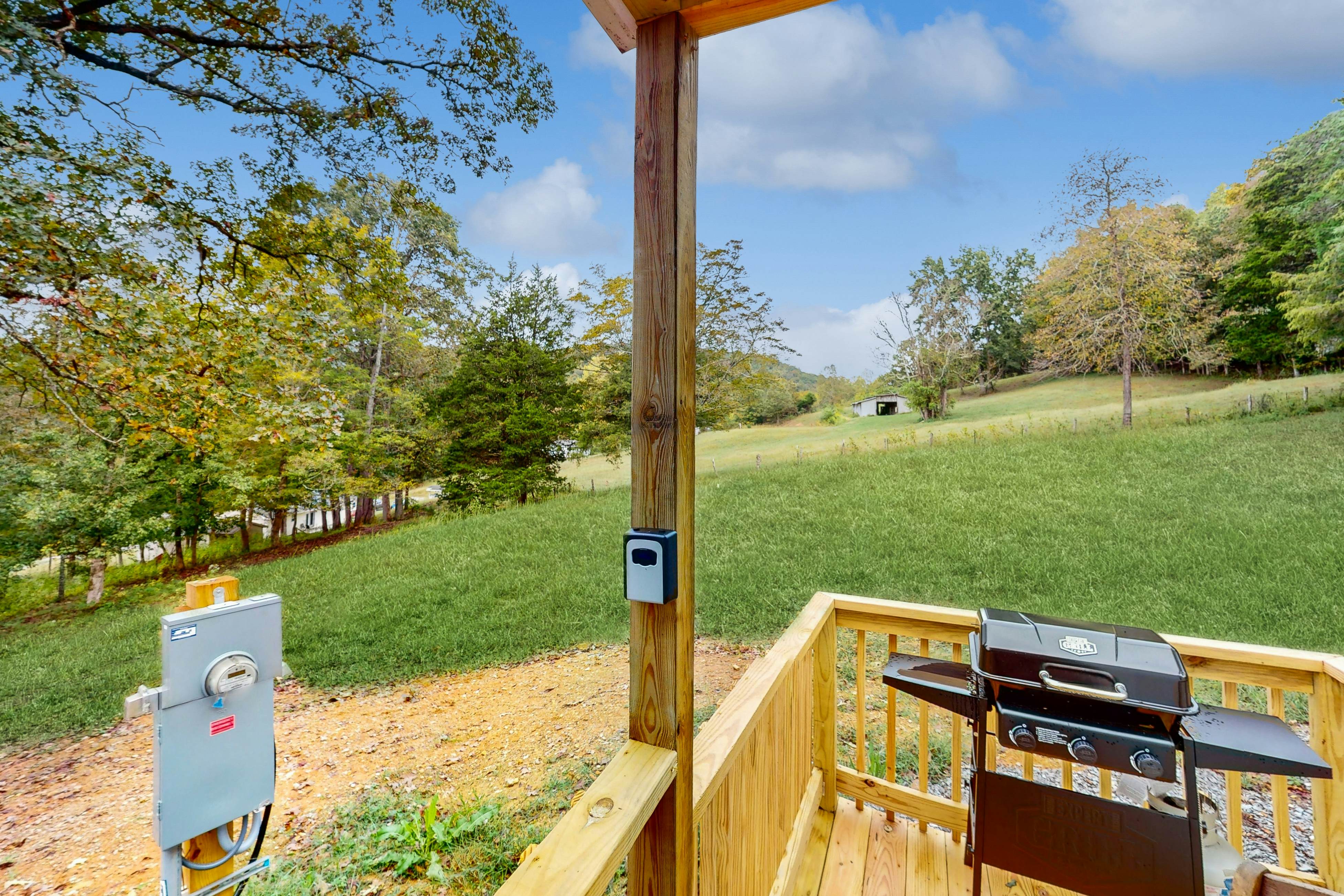 Tiny home studio with kitchenette, grill and front porch