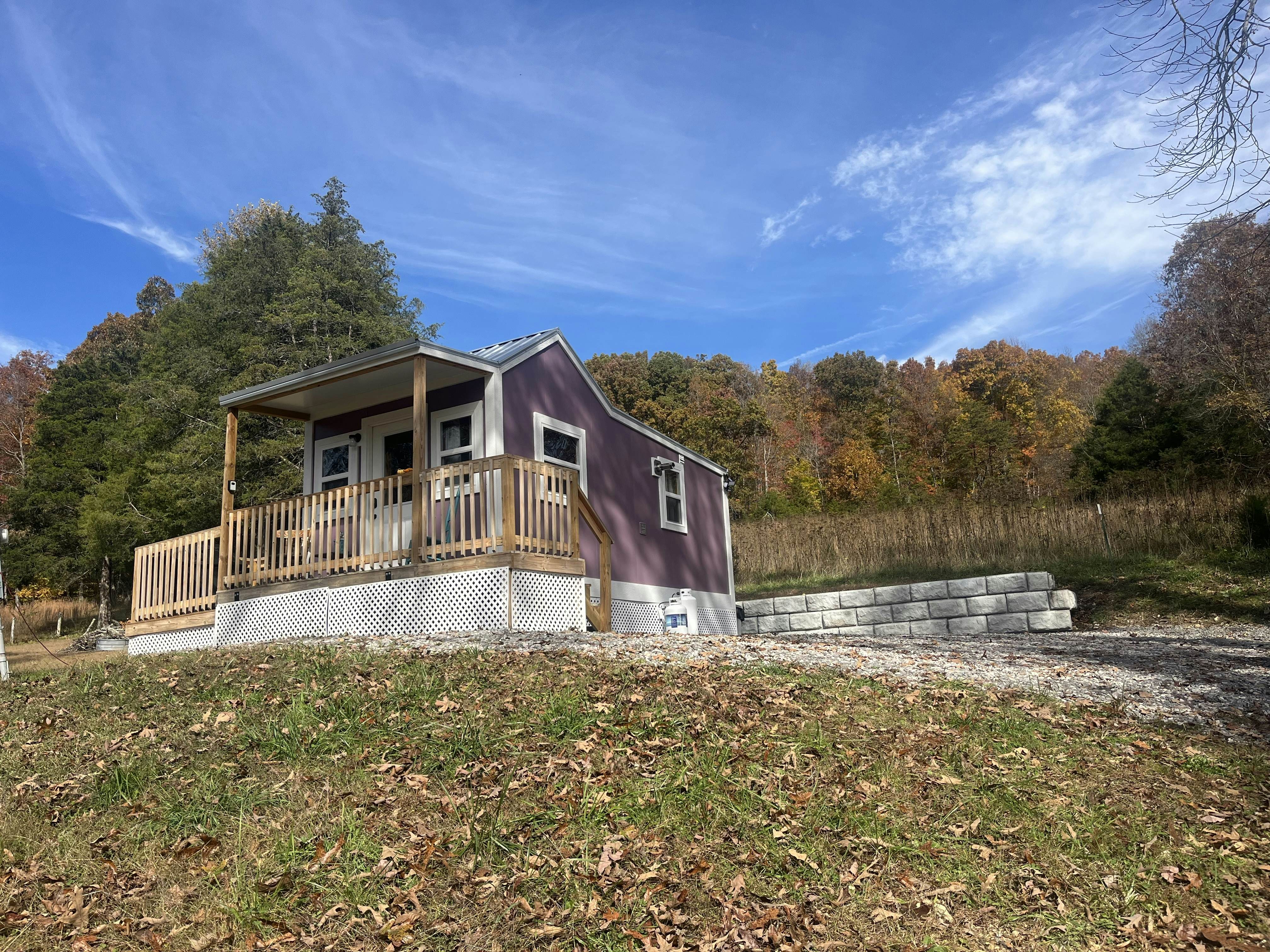 Tiny home studio with kitchenette, grill and front porch