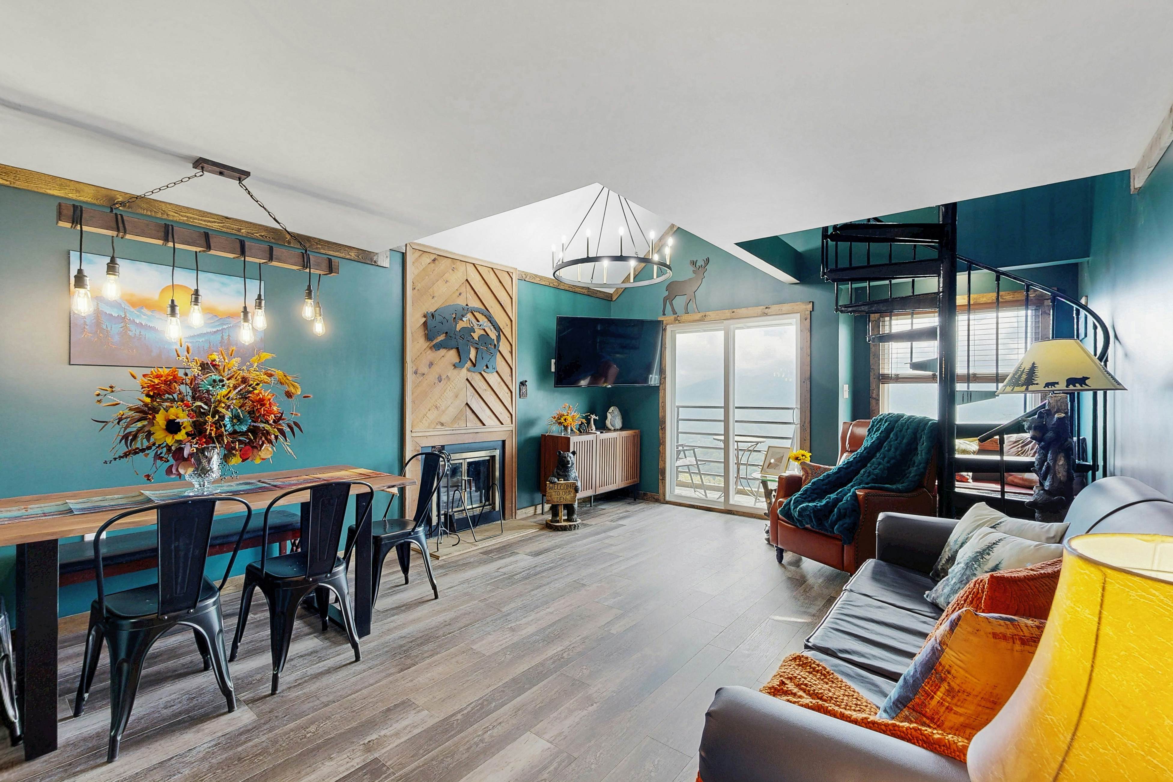 Mountain-view condo with private balcony, pool, & wood-burning fireplace