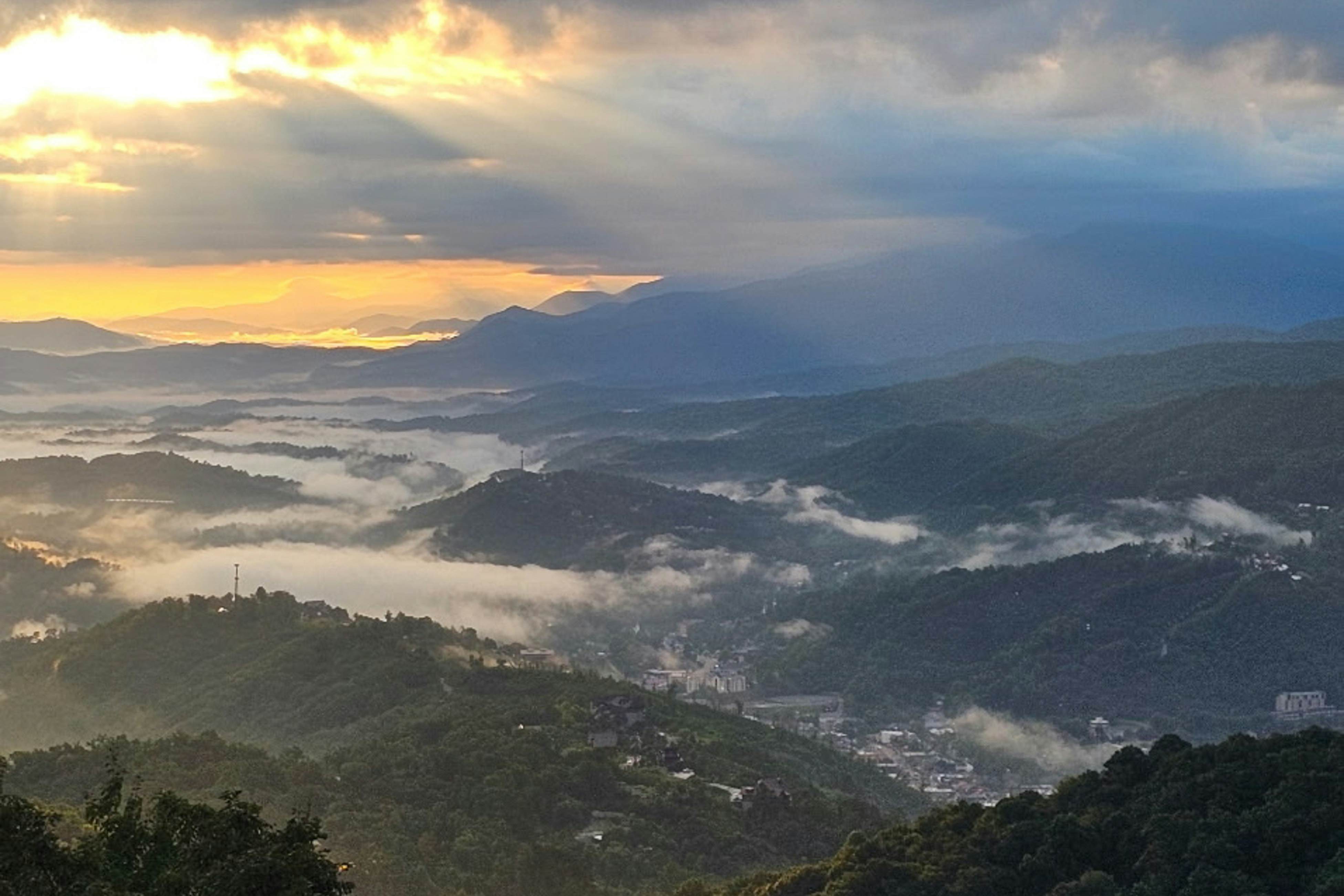 Mountain-view condo with private balcony, pool, & wood-burning fireplace