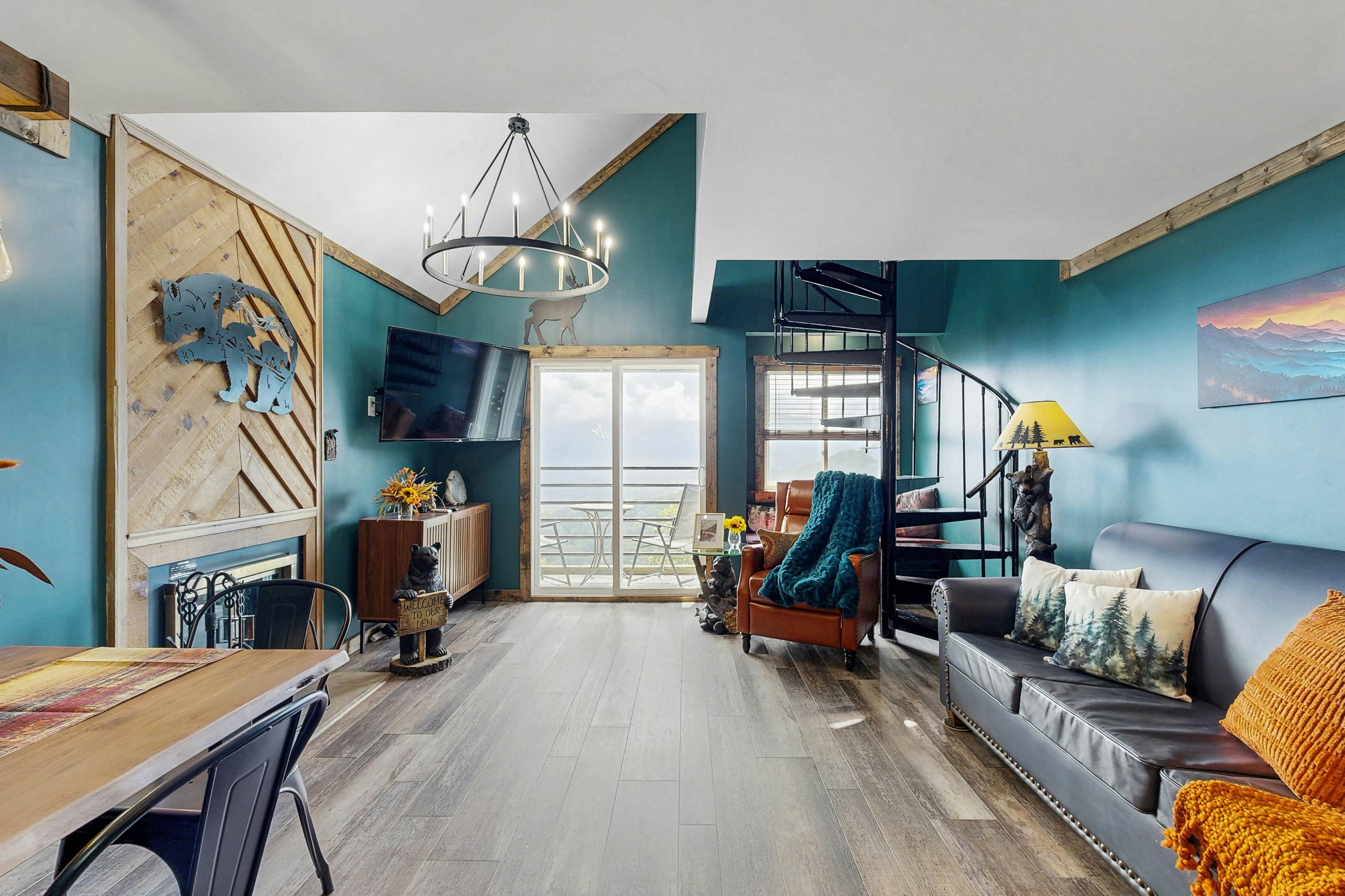 Mountain-view condo with private balcony, pool, & wood-burning fireplace