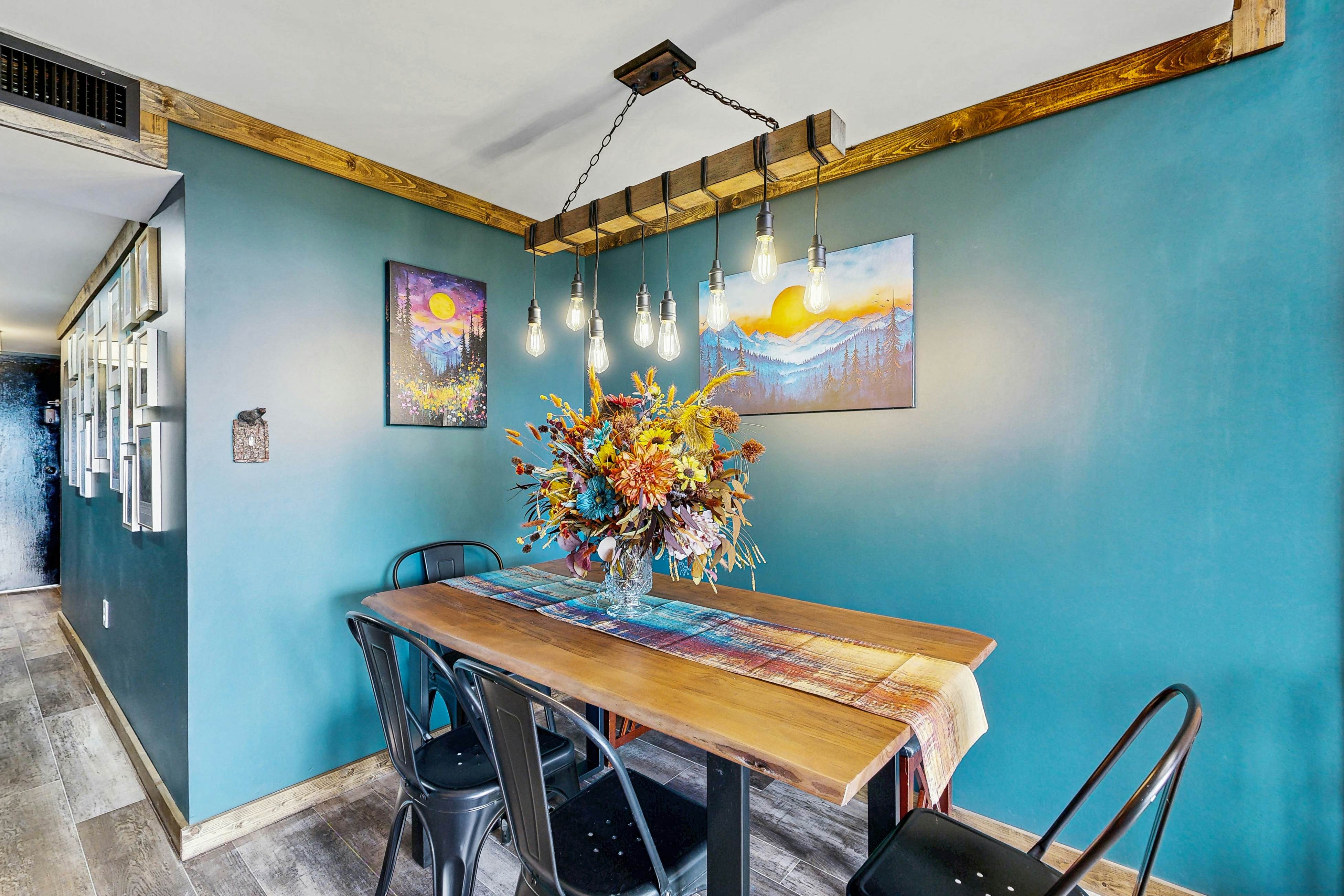 Mountain-view condo with private balcony, pool, & wood-burning fireplace