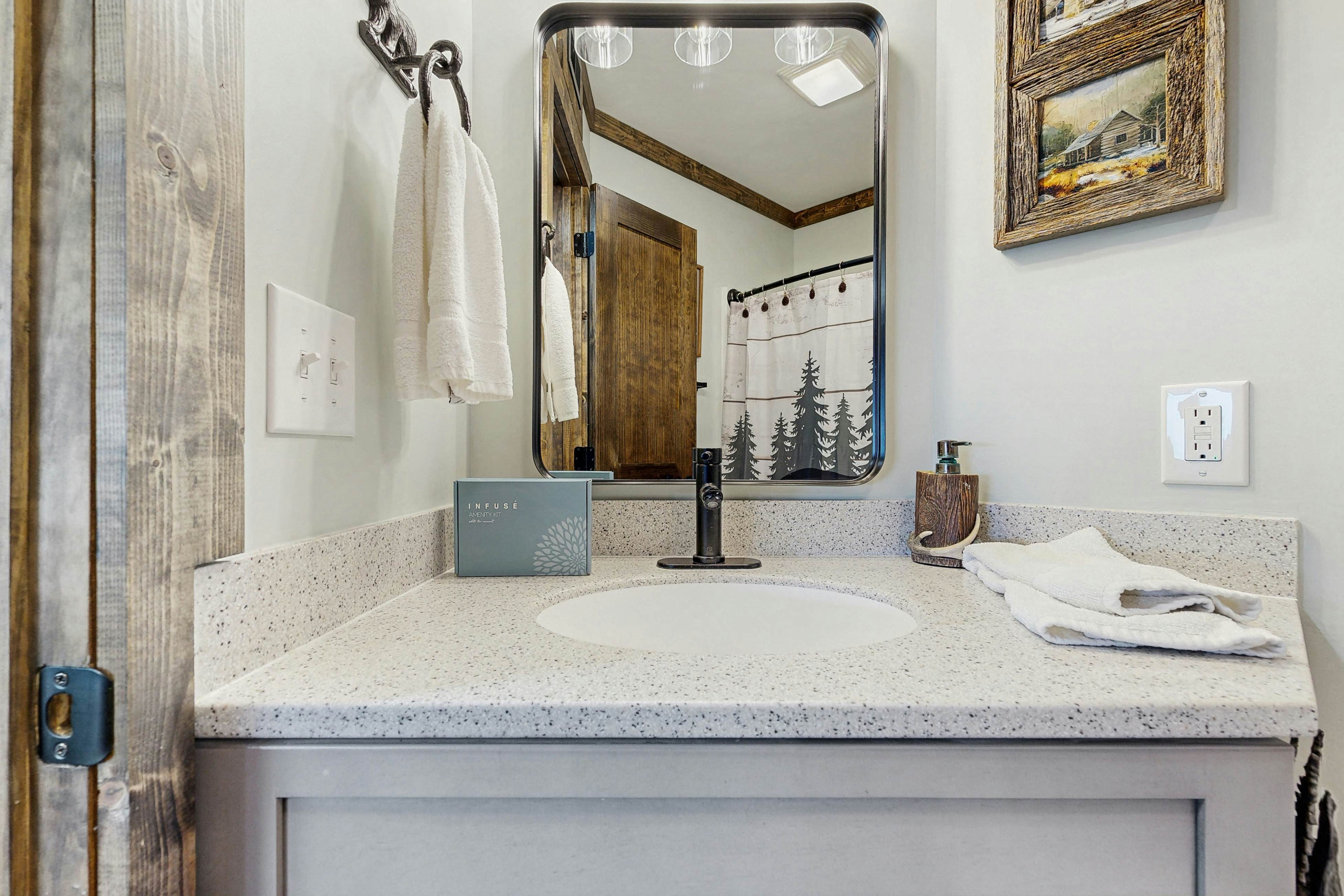 Mountain-view condo with private balcony, pool, & wood-burning fireplace