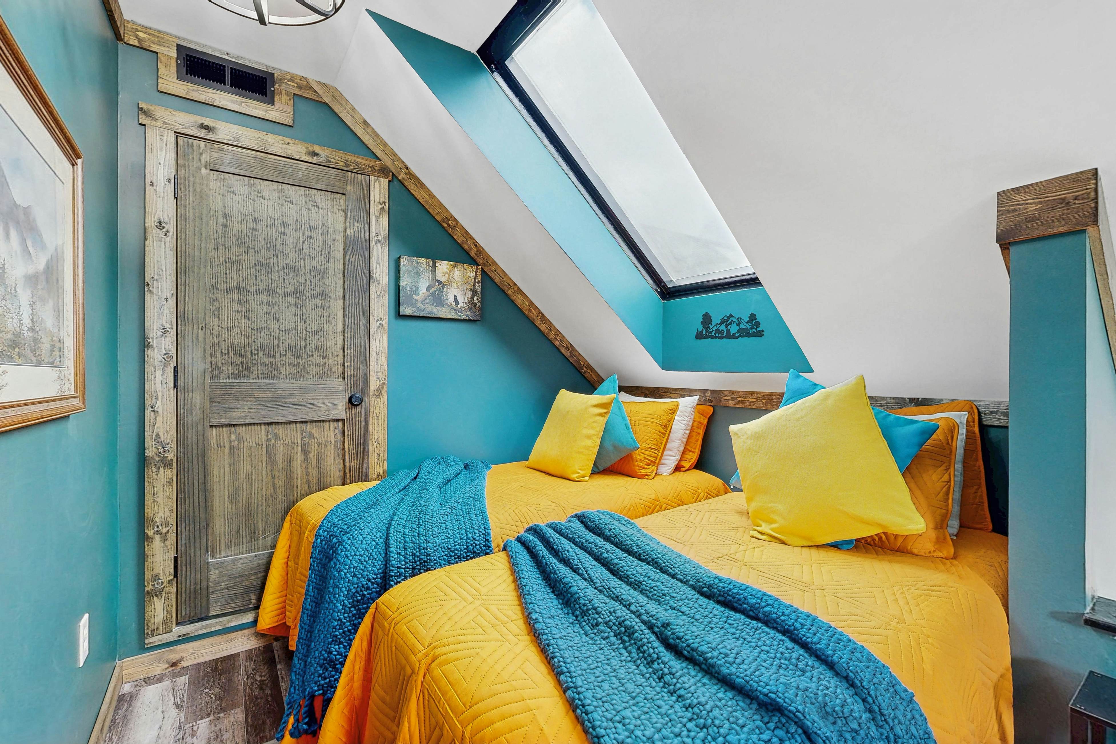 Mountain-view condo with private balcony, pool, & wood-burning fireplace