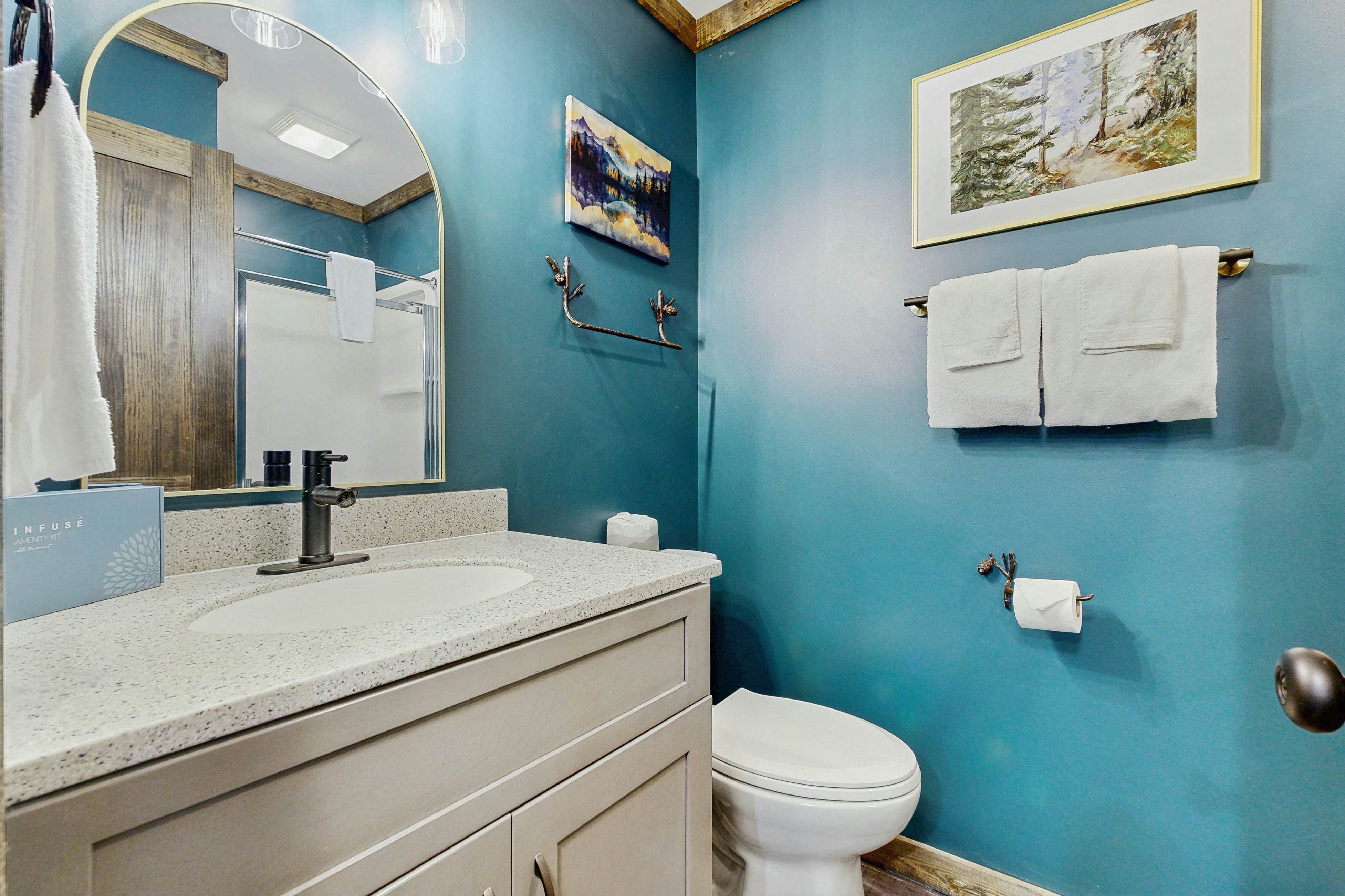 Mountain-view condo with private balcony, pool, & wood-burning fireplace