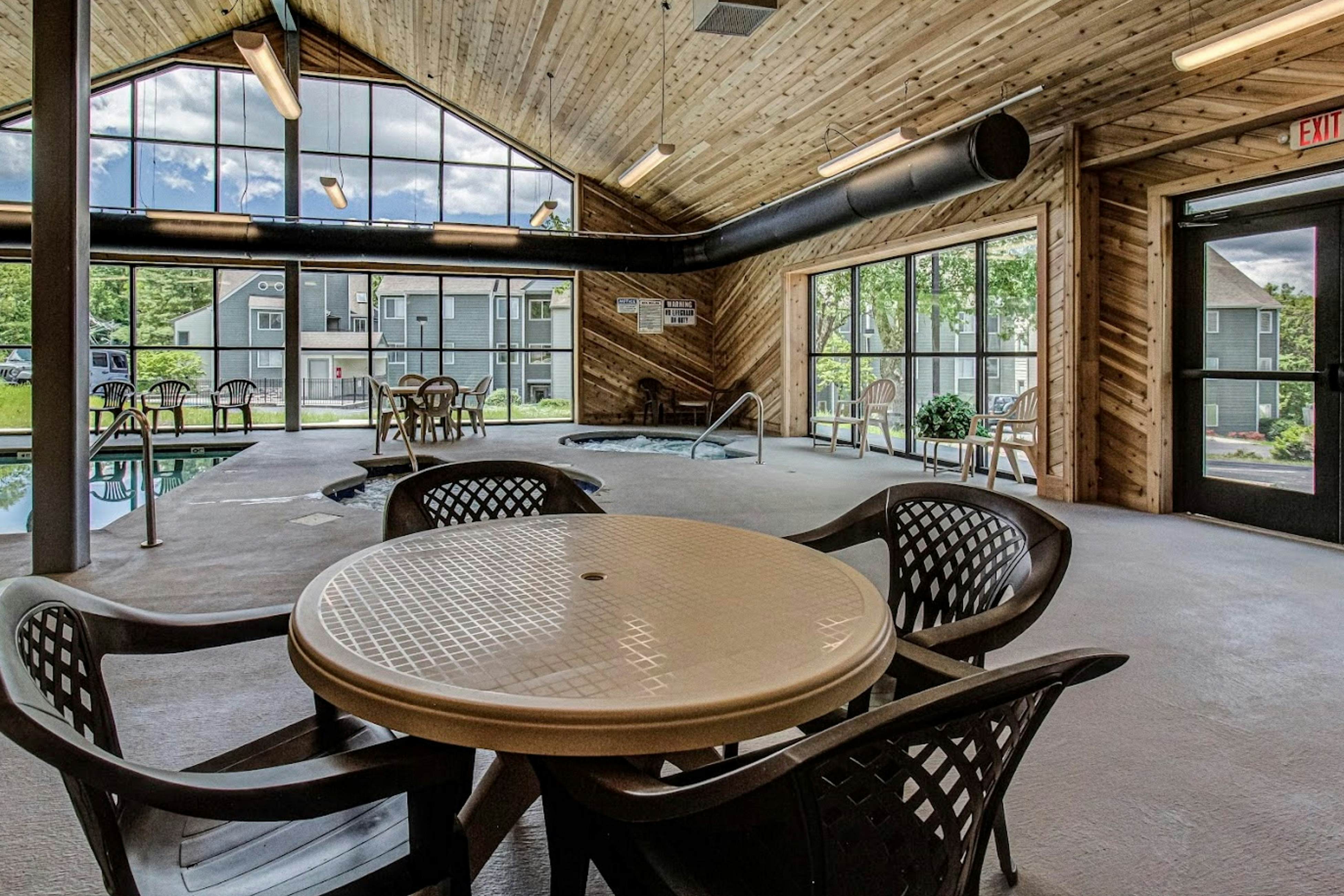 Mountain-view condo with private balcony, pool, & wood-burning fireplace