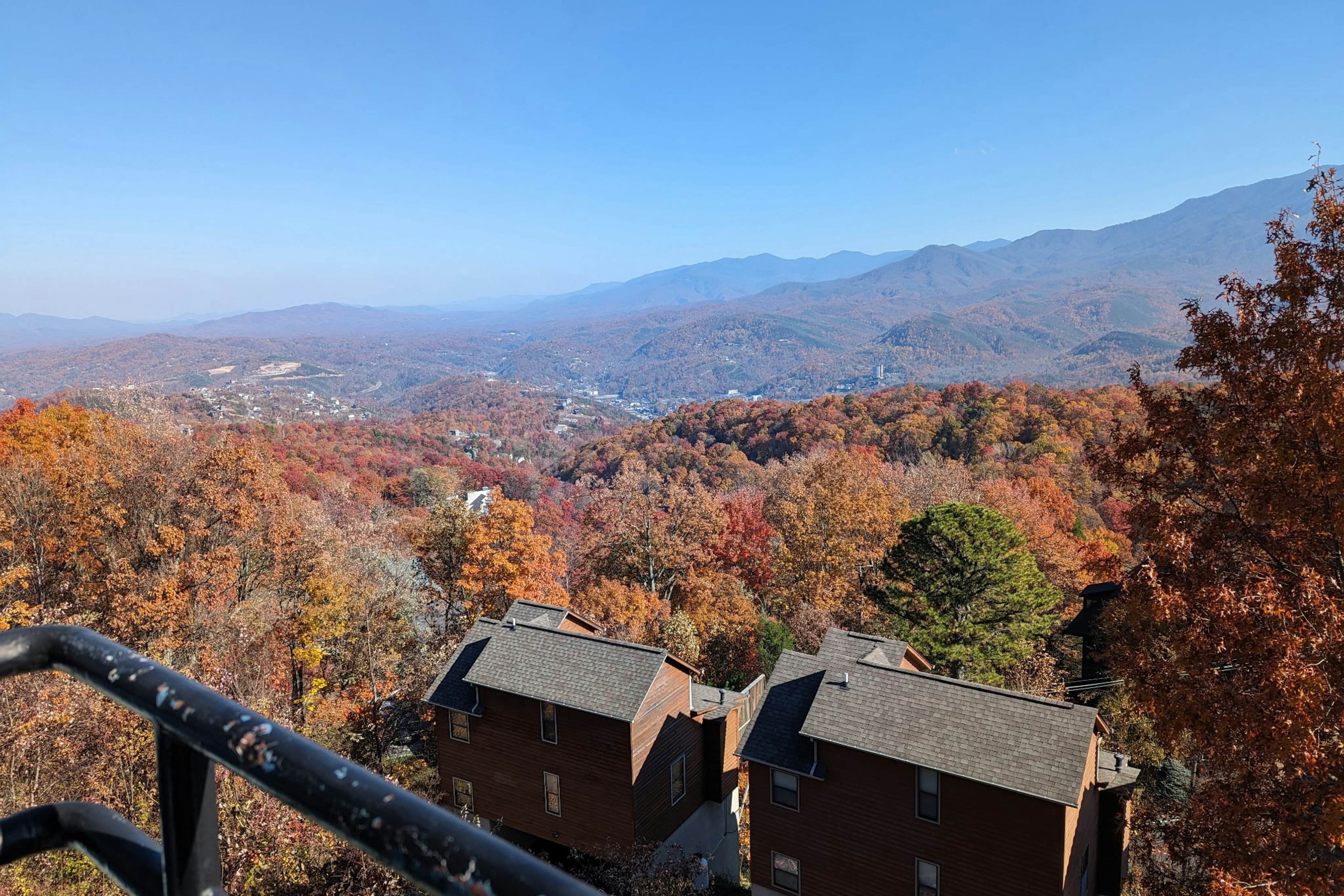 Mountain-view condo with private balcony, pool, & wood-burning fireplace