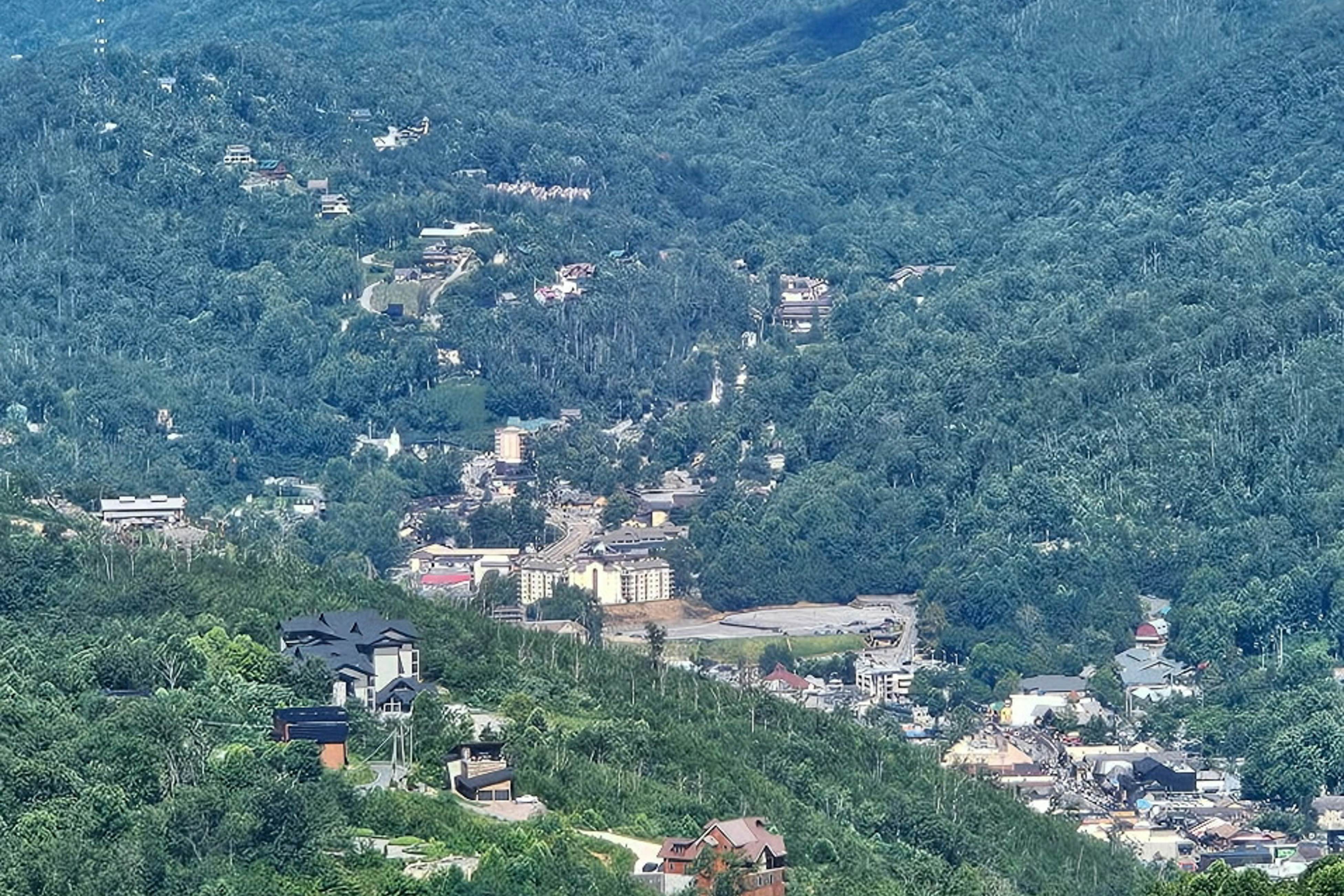 Mountain-view condo with private balcony, pool, & wood-burning fireplace