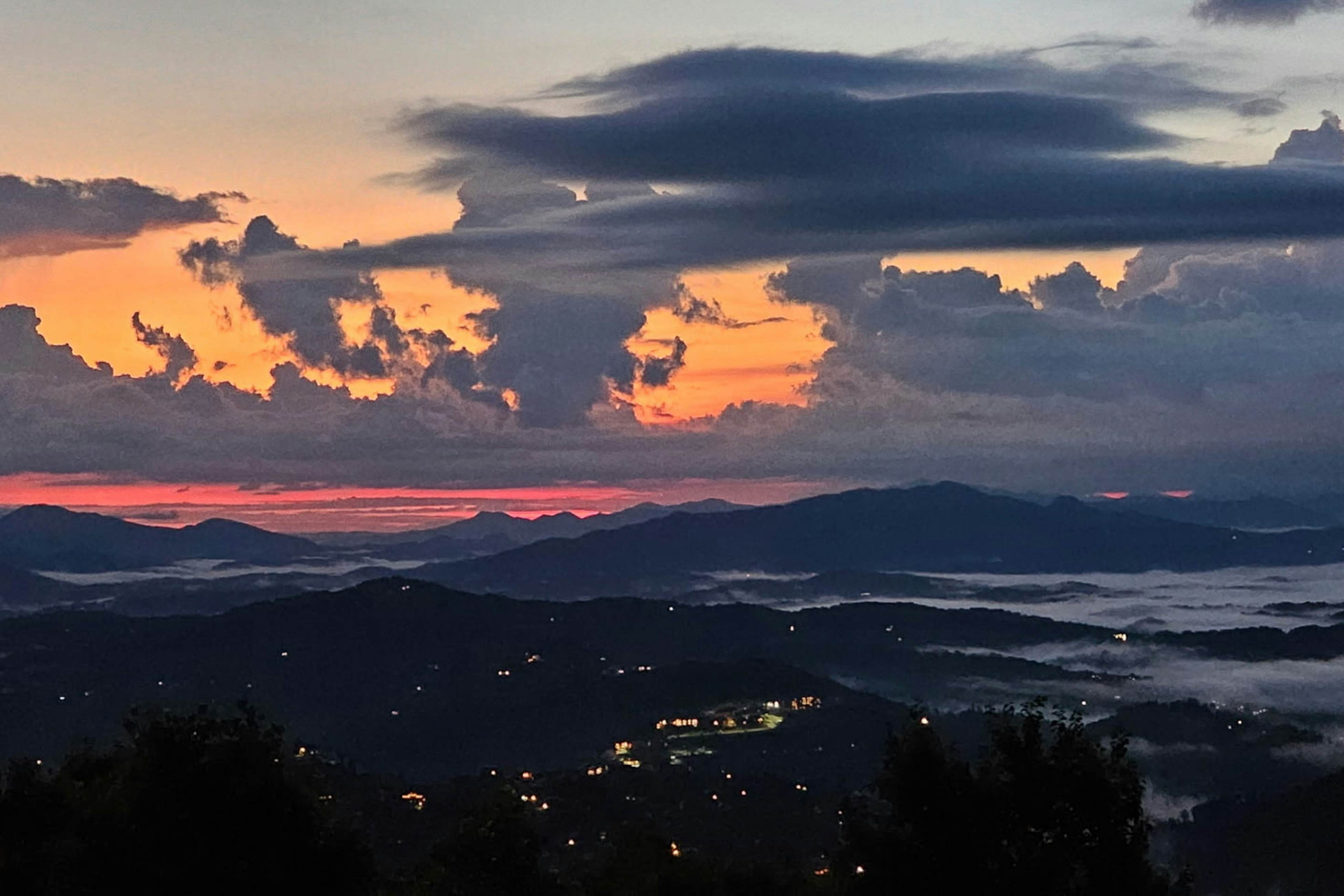 Mountain-view condo with private balcony, pool, & wood-burning fireplace