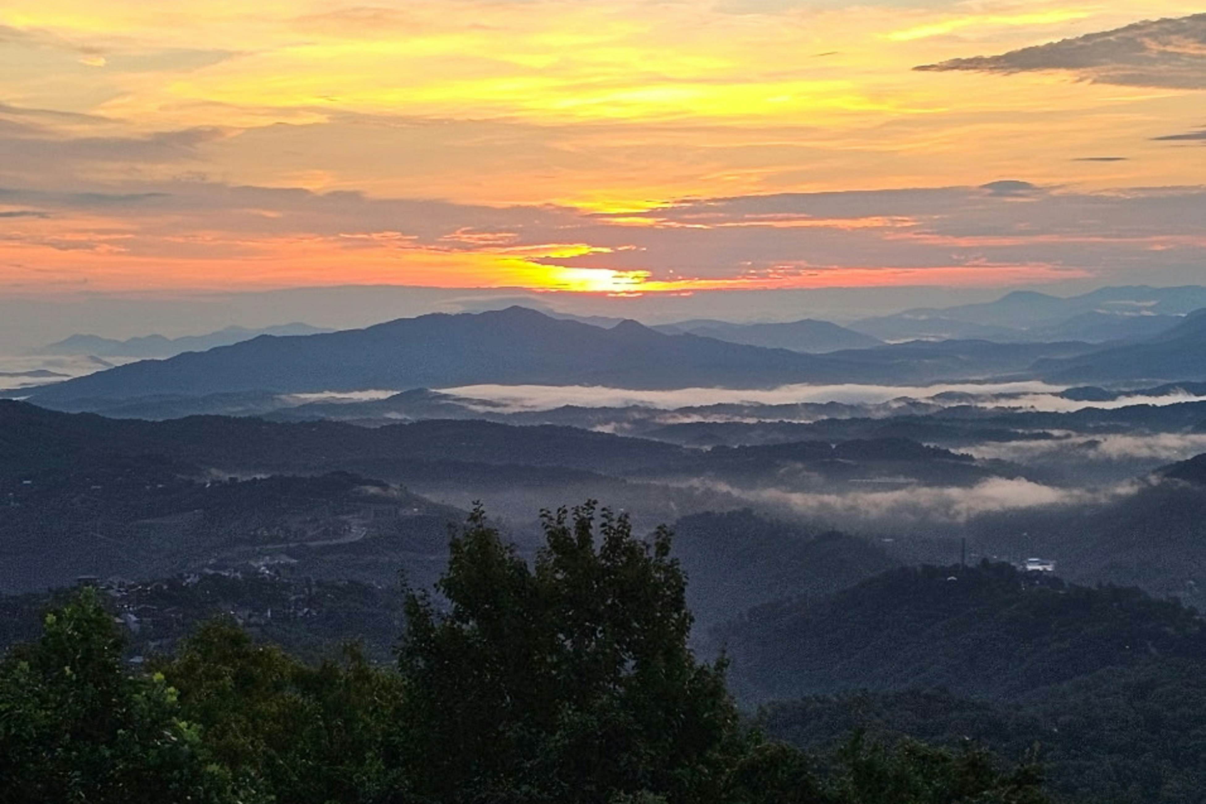 Mountain-view condo with private balcony, pool, & wood-burning fireplace