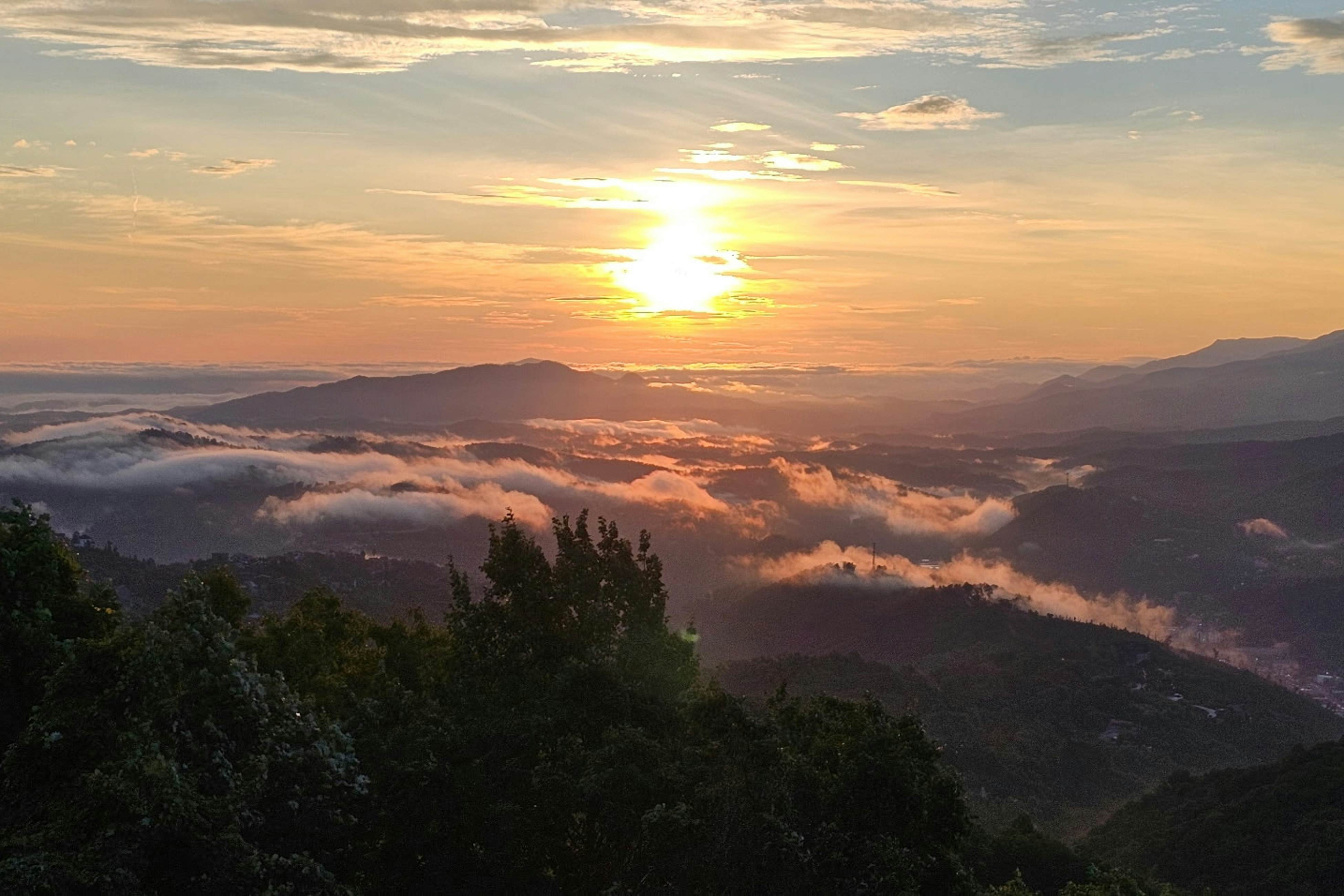 Mountain-view condo with private balcony, pool, & wood-burning fireplace