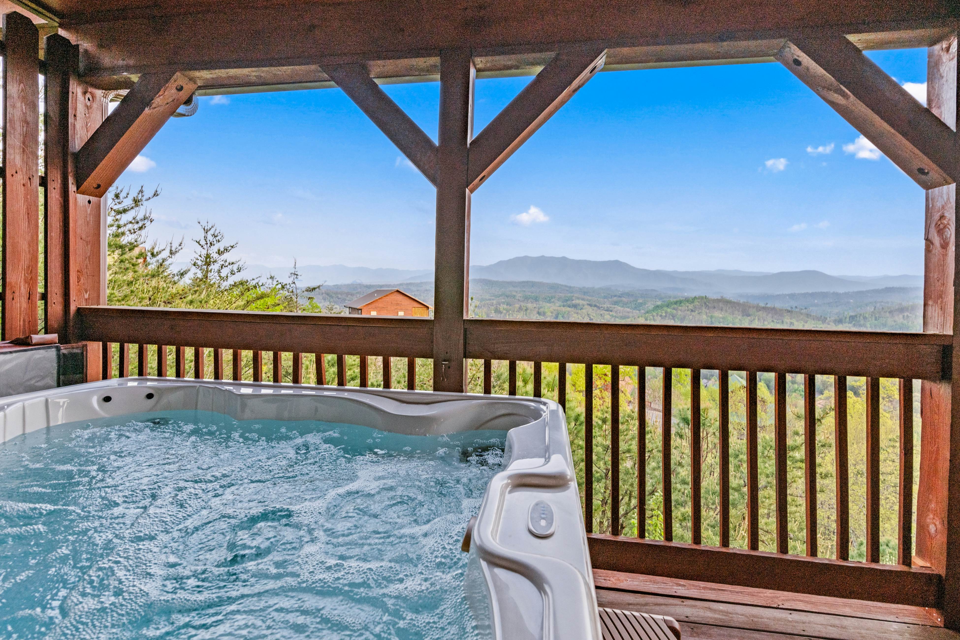 Rustic log cabin w/ Free Attraction Tickets, mountain views, hot tub, & games