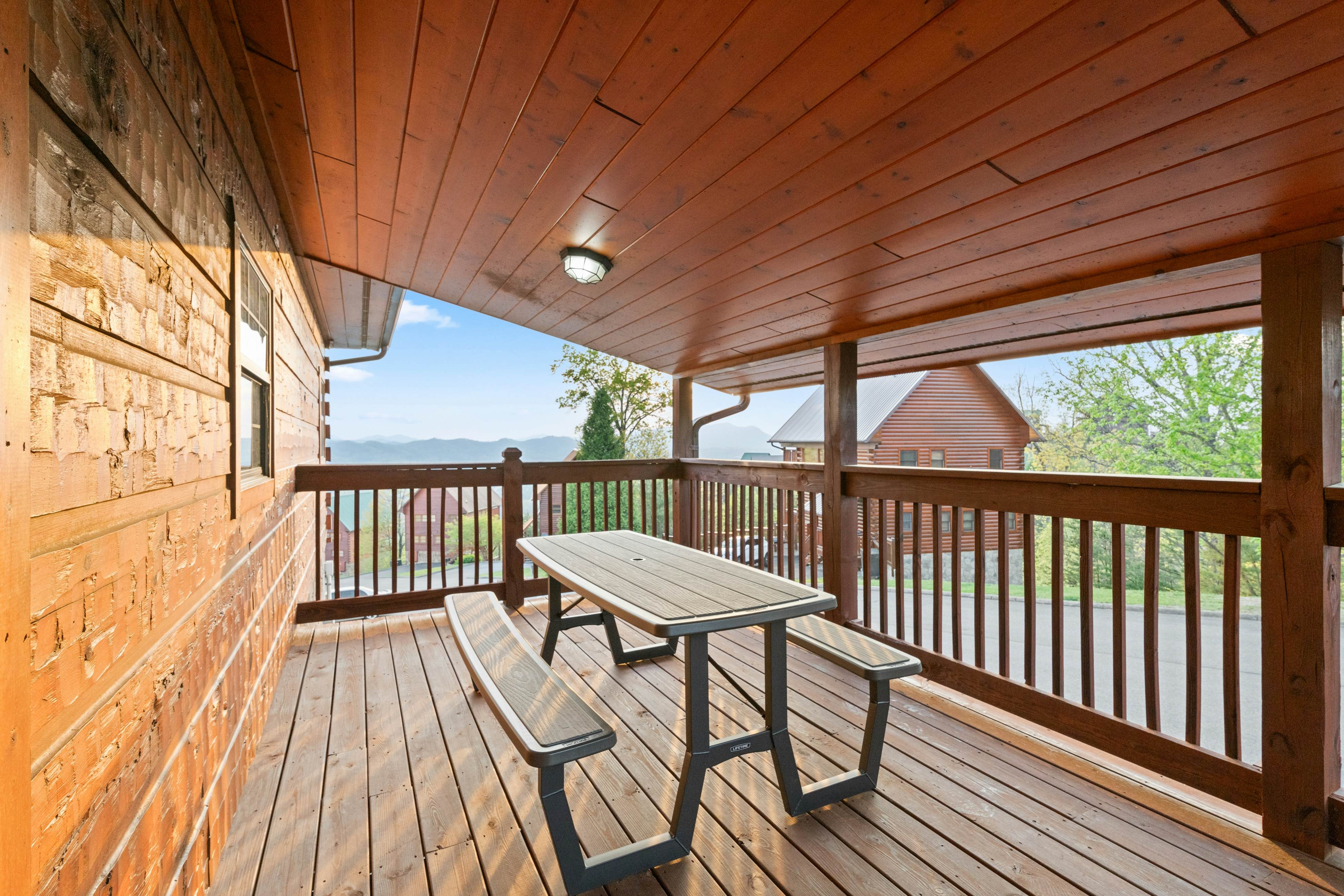 Rustic log cabin w/ Free Attraction Tickets, mountain views, hot tub, & games