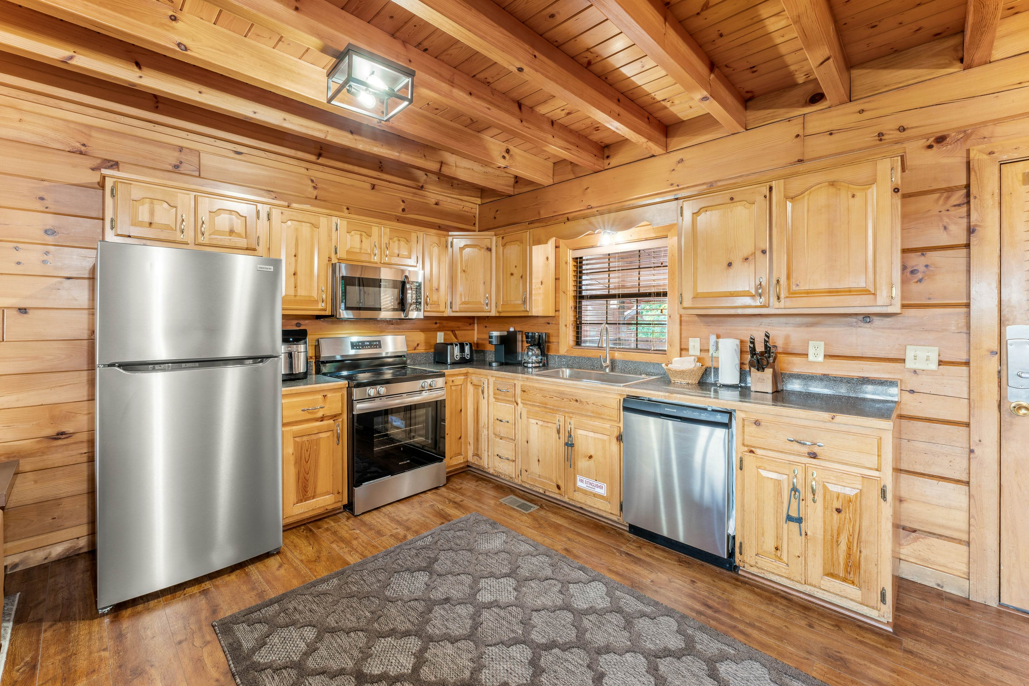 Rustic log cabin w/ Free Attraction Tickets, mountain views, hot tub, & games