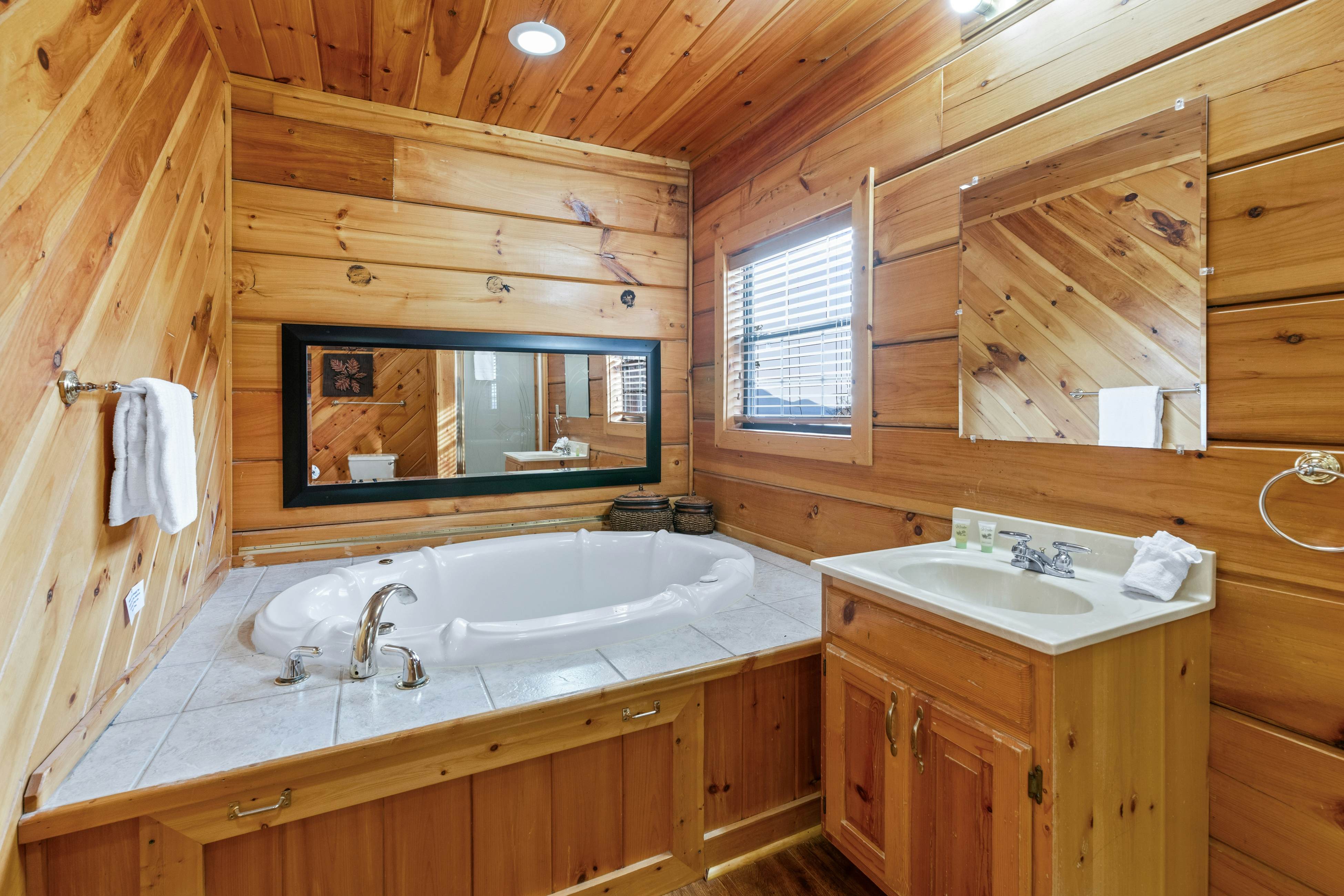 Rustic log cabin w/ Free Attraction Tickets, mountain views, hot tub, & games
