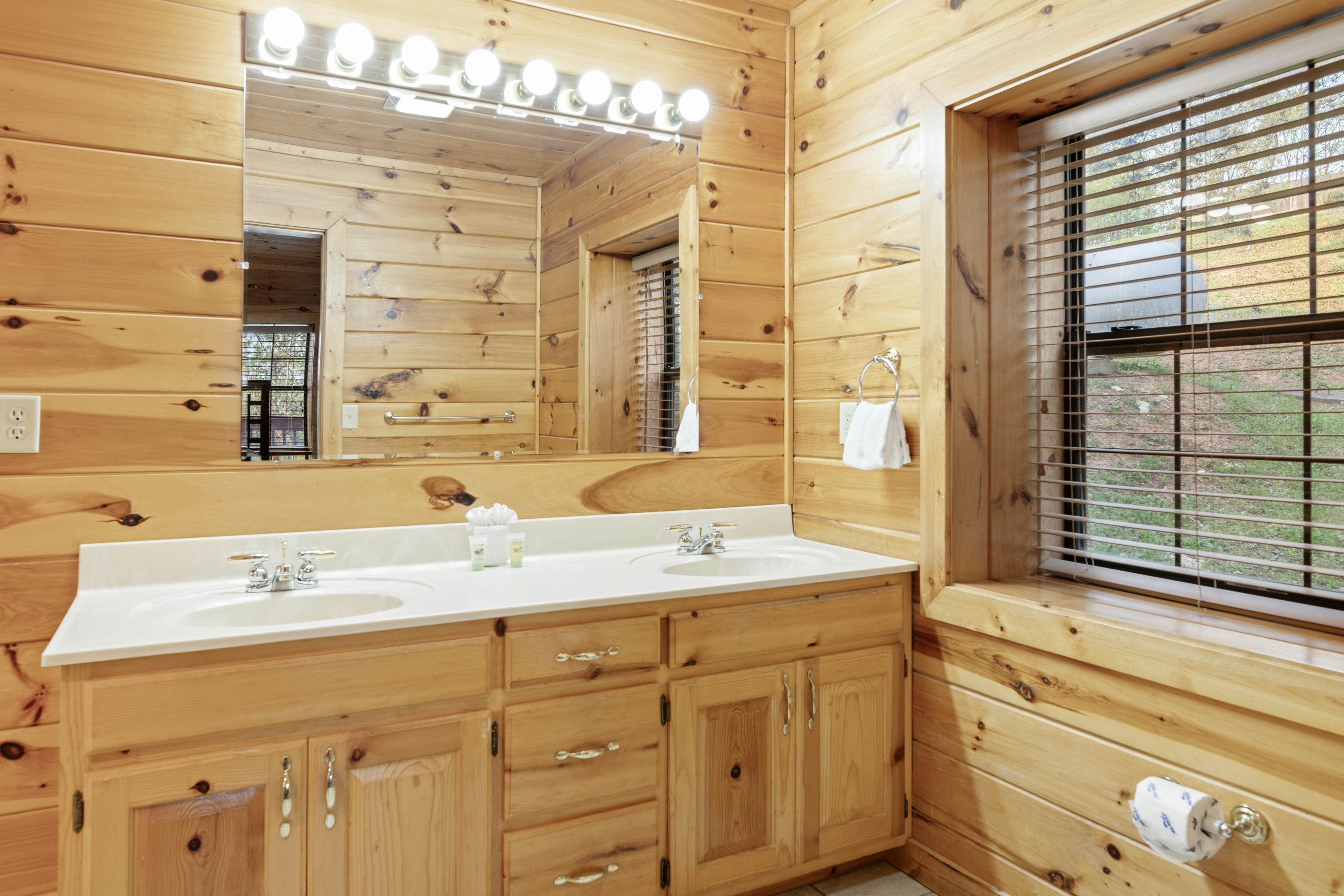 Rustic log cabin w/ Free Attraction Tickets, mountain views, hot tub, & games