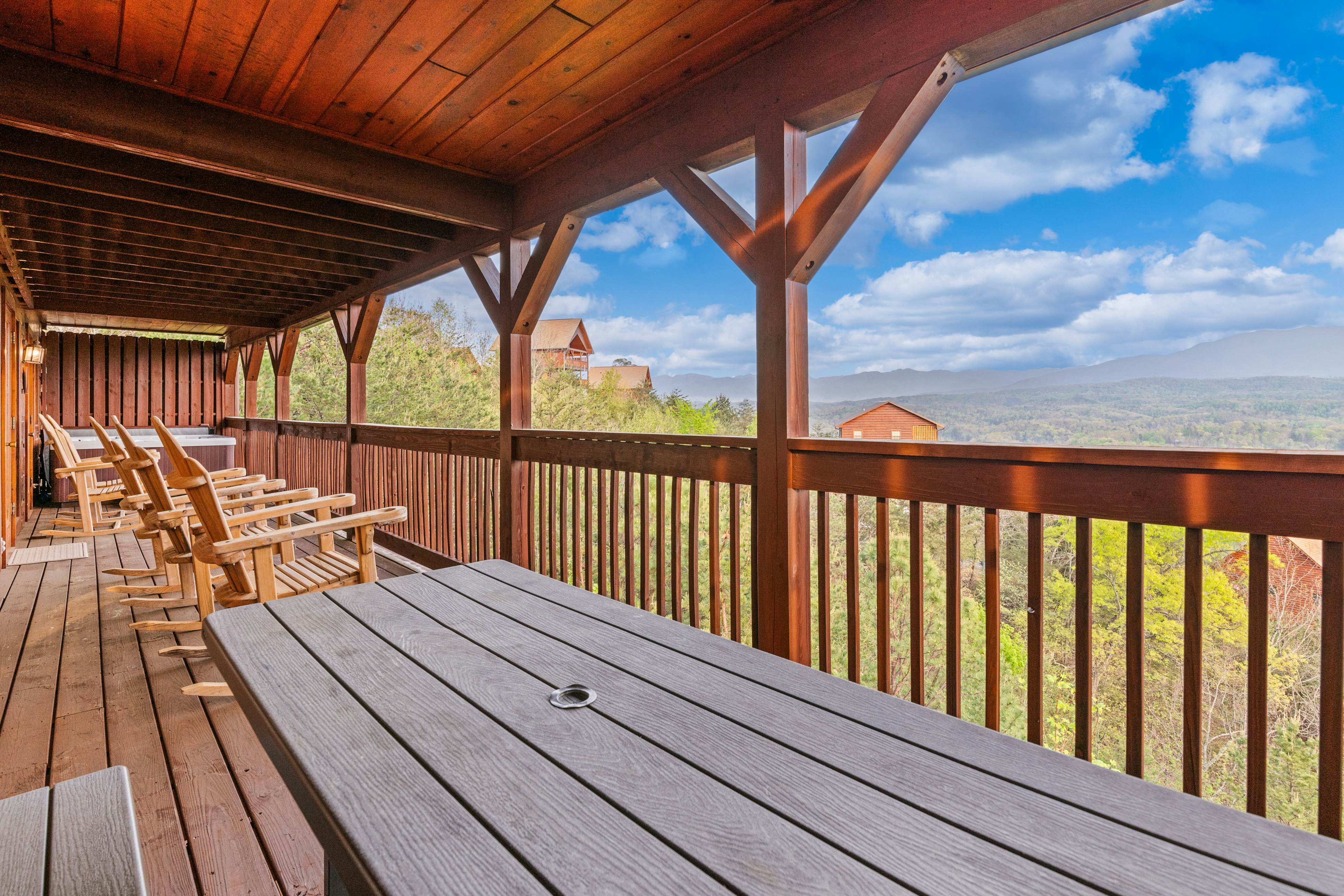 Rustic log cabin w/ Free Attraction Tickets, mountain views, hot tub, & games