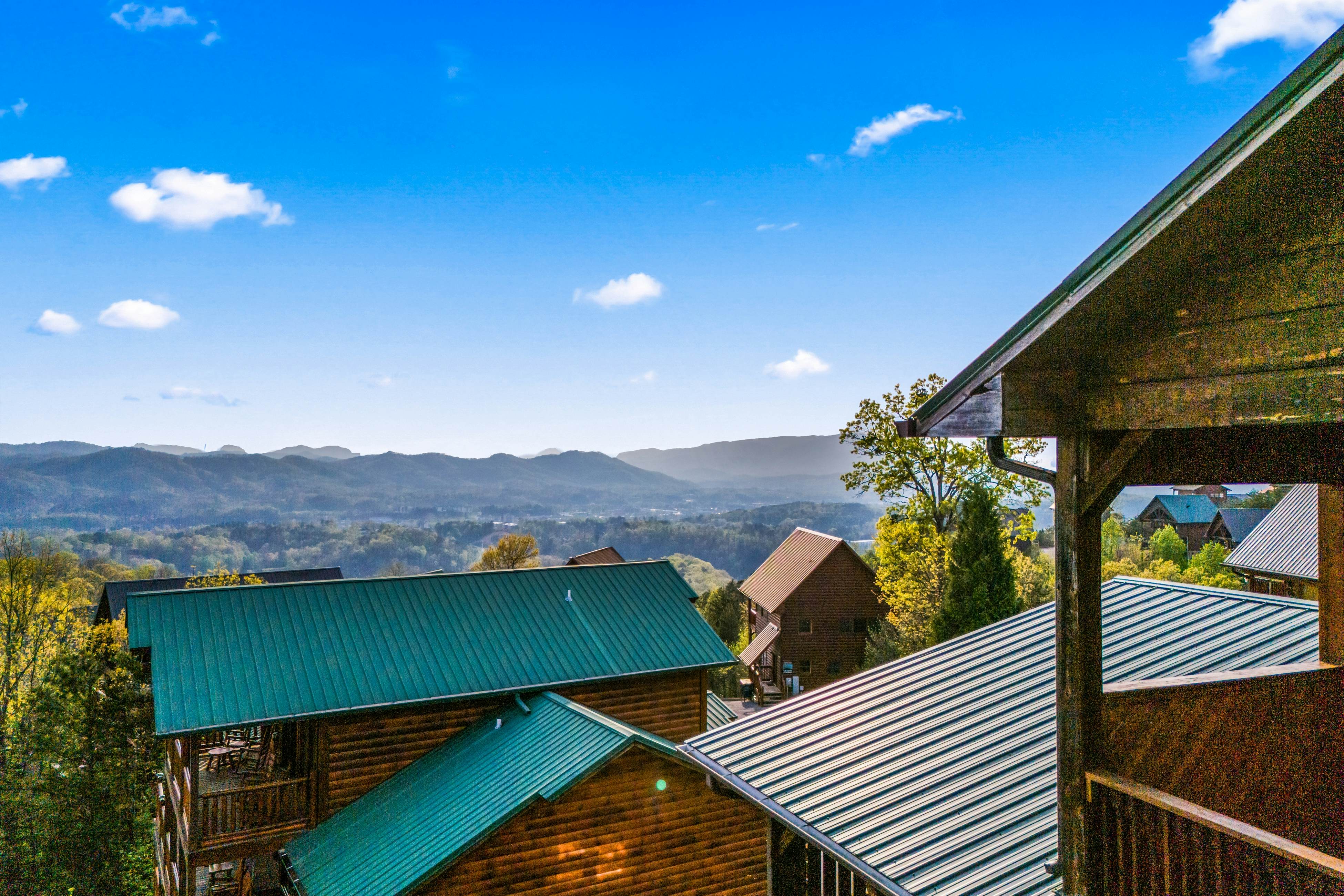 Rustic log cabin w/ Free Attraction Tickets, mountain views, hot tub, & games