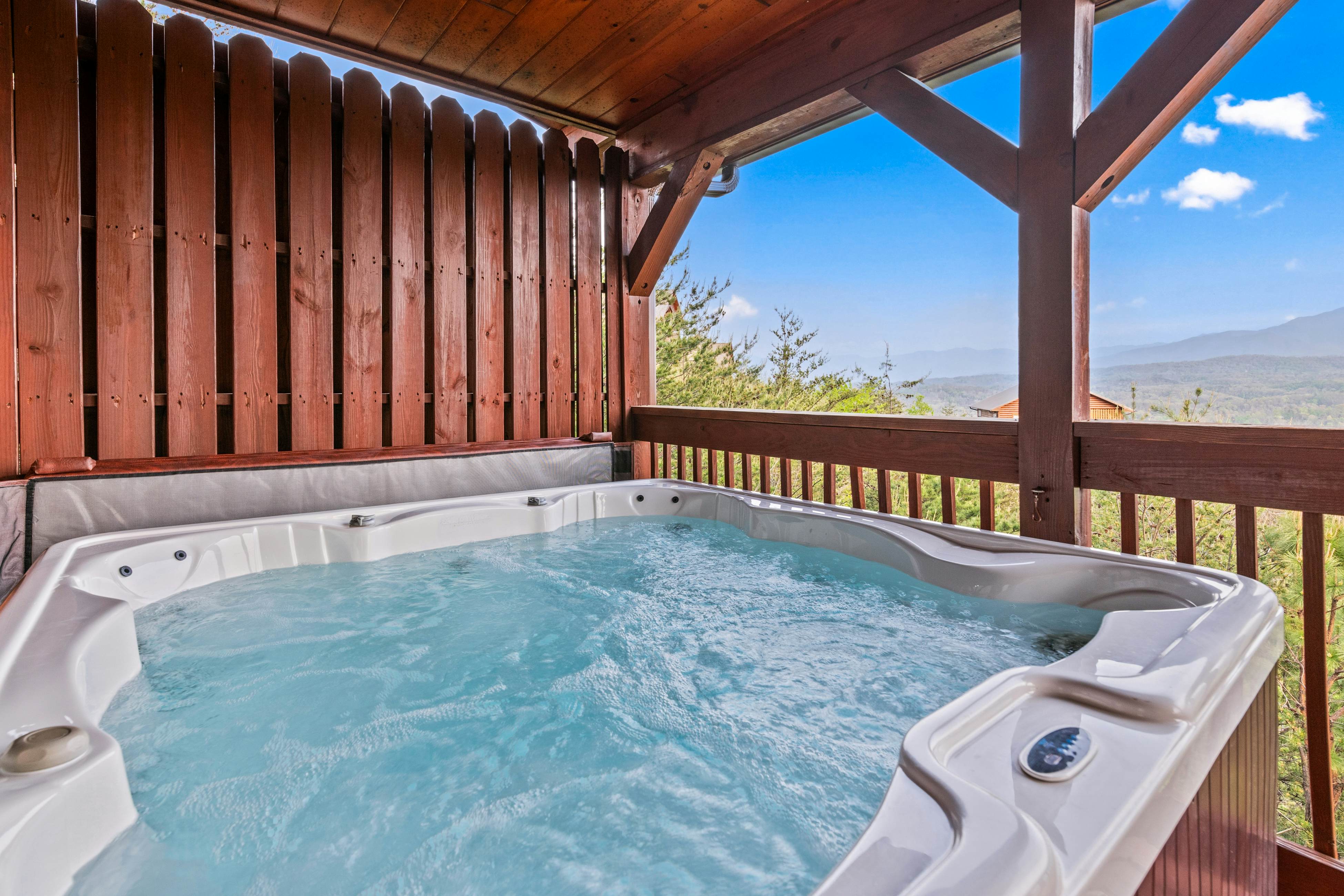 Rustic log cabin w/ Free Attraction Tickets, mountain views, hot tub, & games