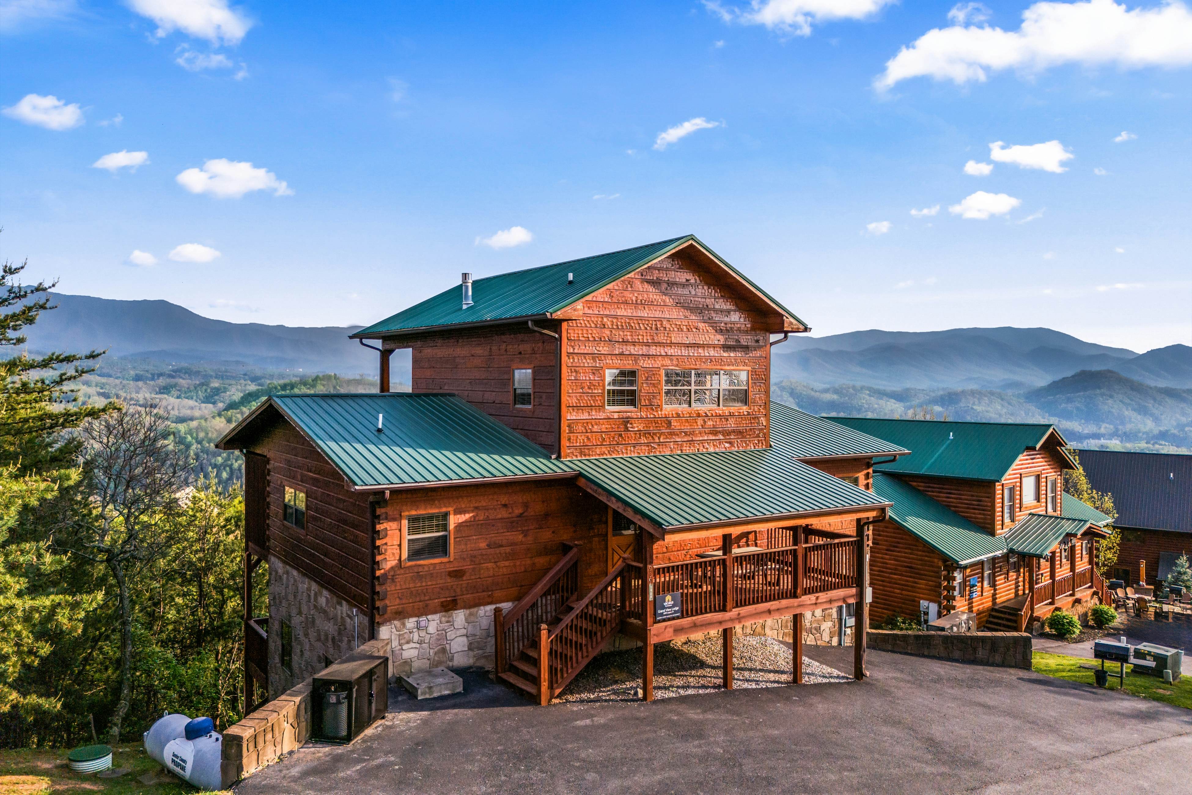 Rustic log cabin w/ Free Attraction Tickets, mountain views, hot tub, & games