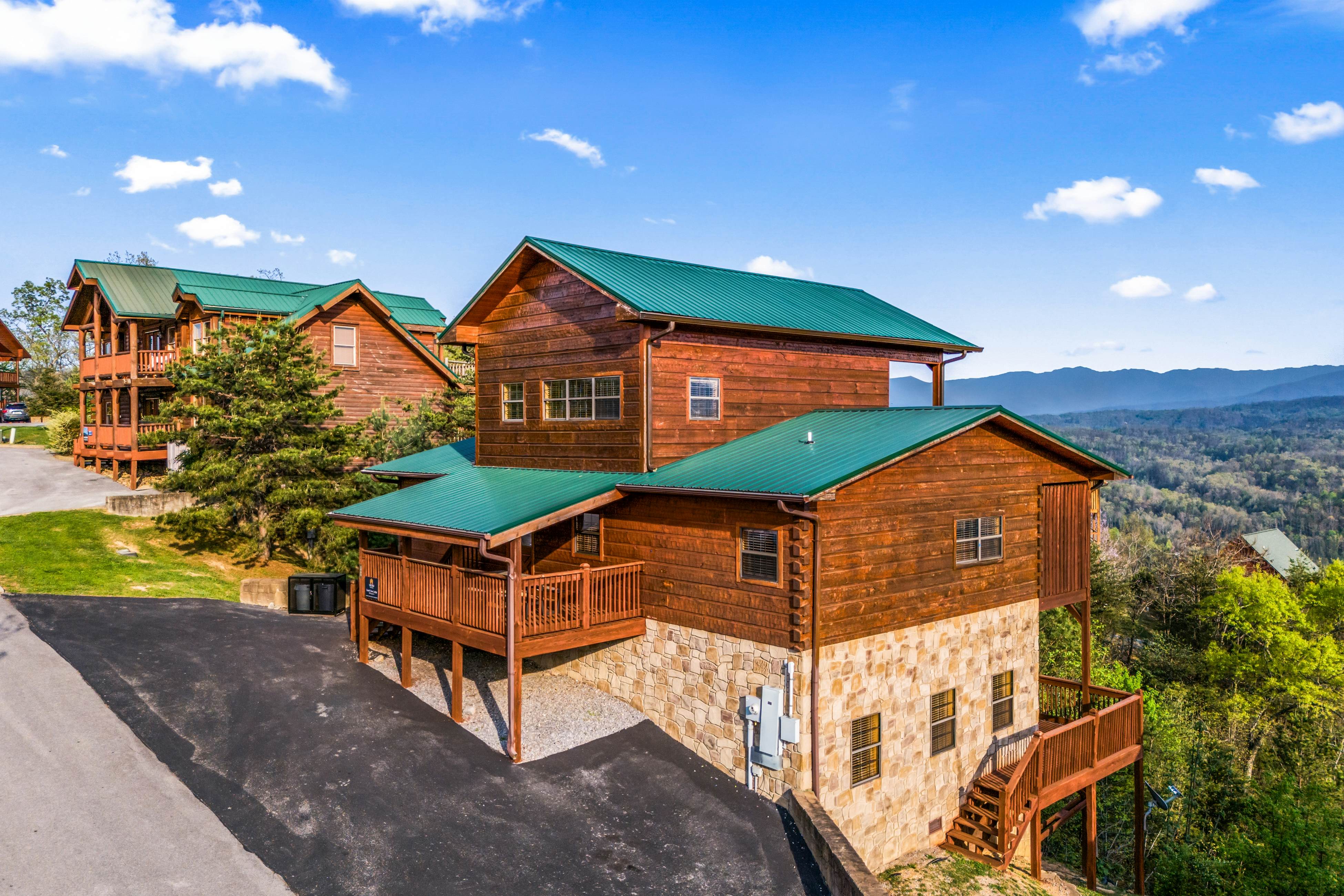 Rustic log cabin w/ Free Attraction Tickets, mountain views, hot tub, & games