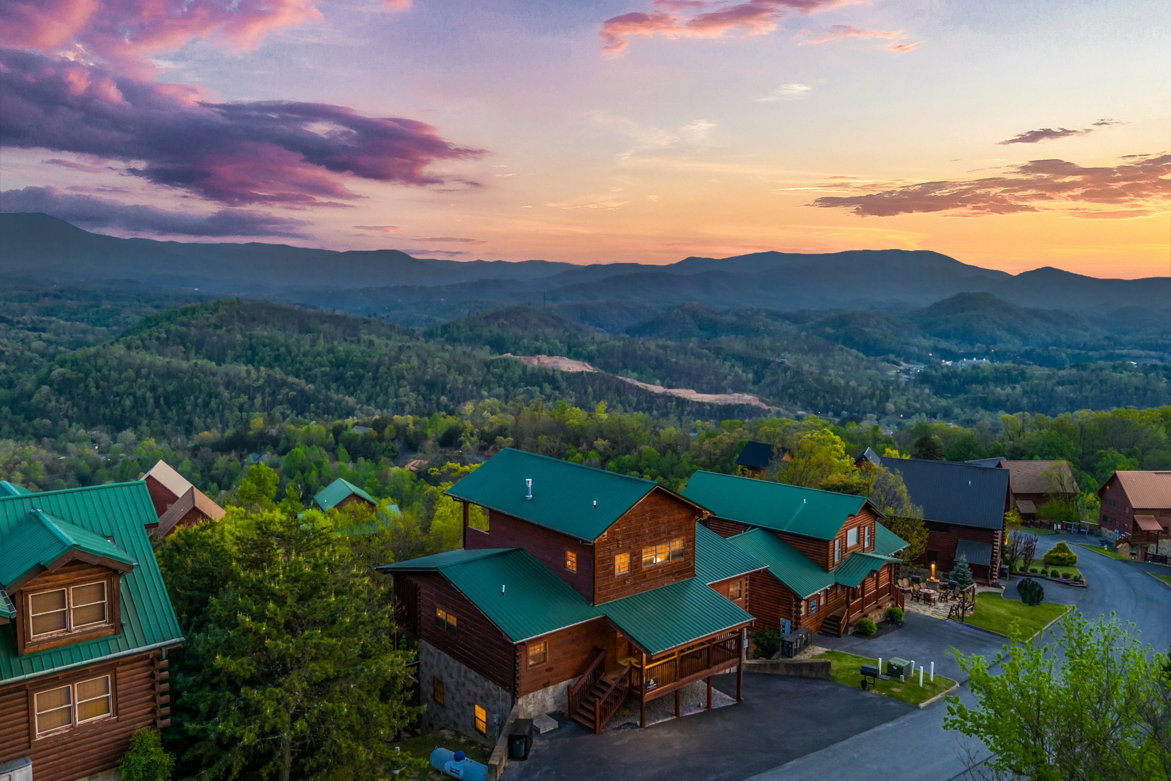 Rustic log cabin w/ Free Attraction Tickets, mountain views, hot tub, & games