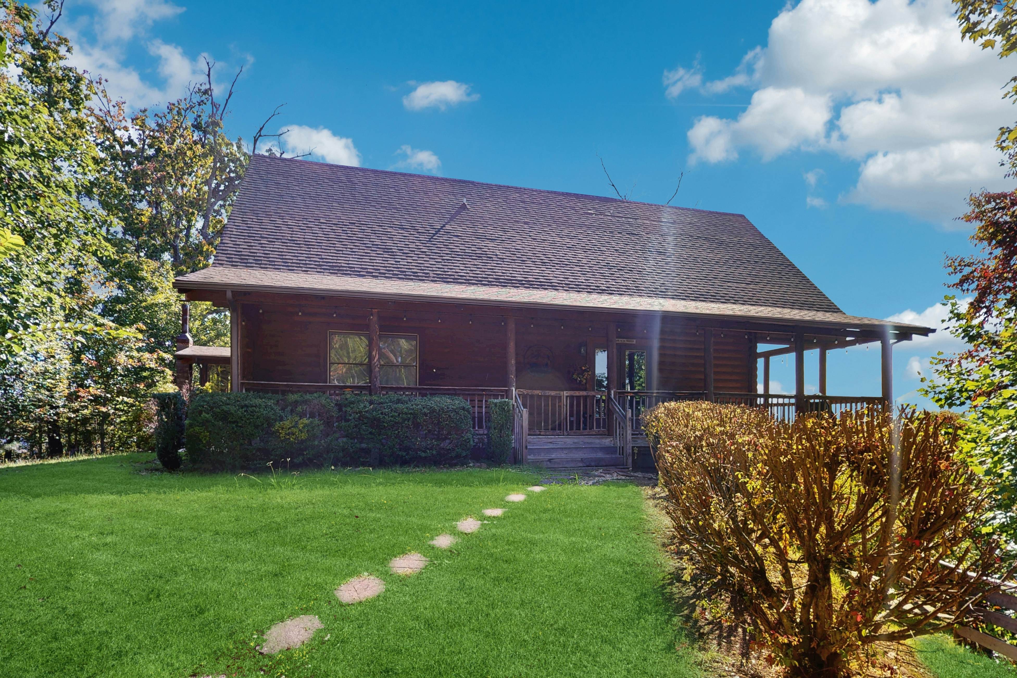 Mountain-view cabin with fireplaces, screened patio, & free attraction tickets