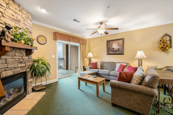 2BR/2BA downtown Gatlinburg condo sleeping 8 with mountain views, private balconies, seasonal pool, hot tub, fireplace, and easy walking access to top attractions, dining, hiking, and Ober Gatlinburg.