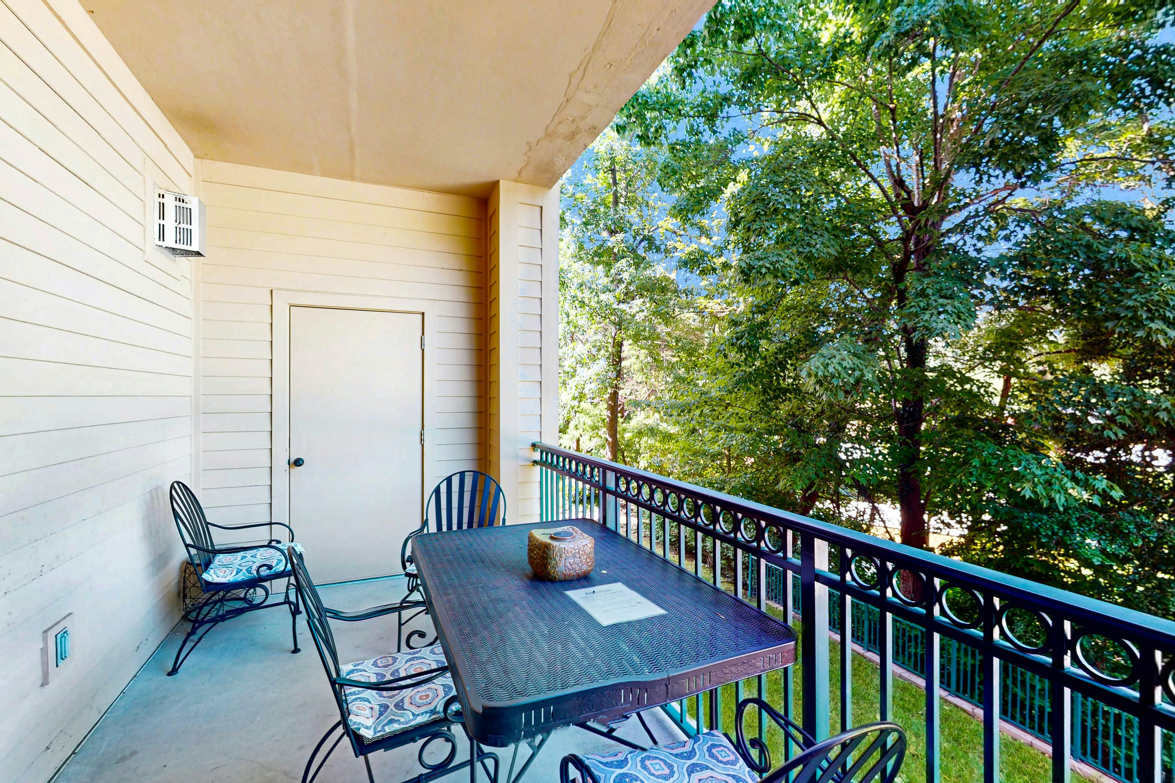 Central condo with private balcony, free attraction tickets, & pool/hot tub