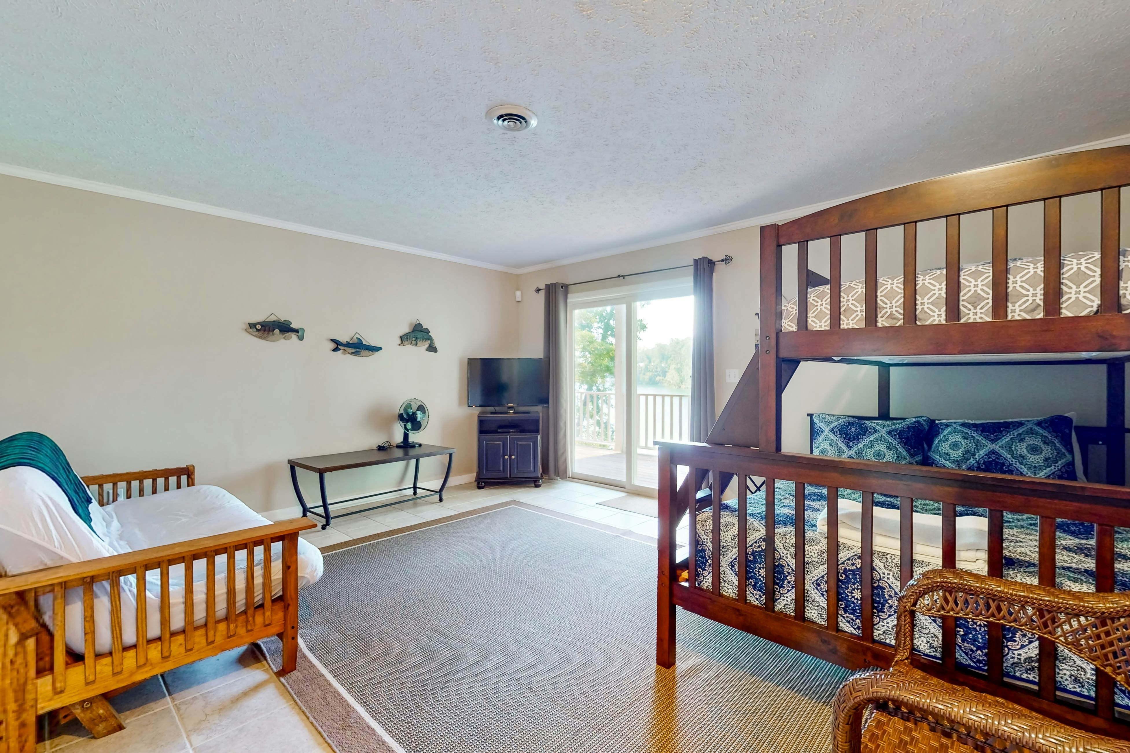 Lake front home with games, fire pit, gas grill and dock