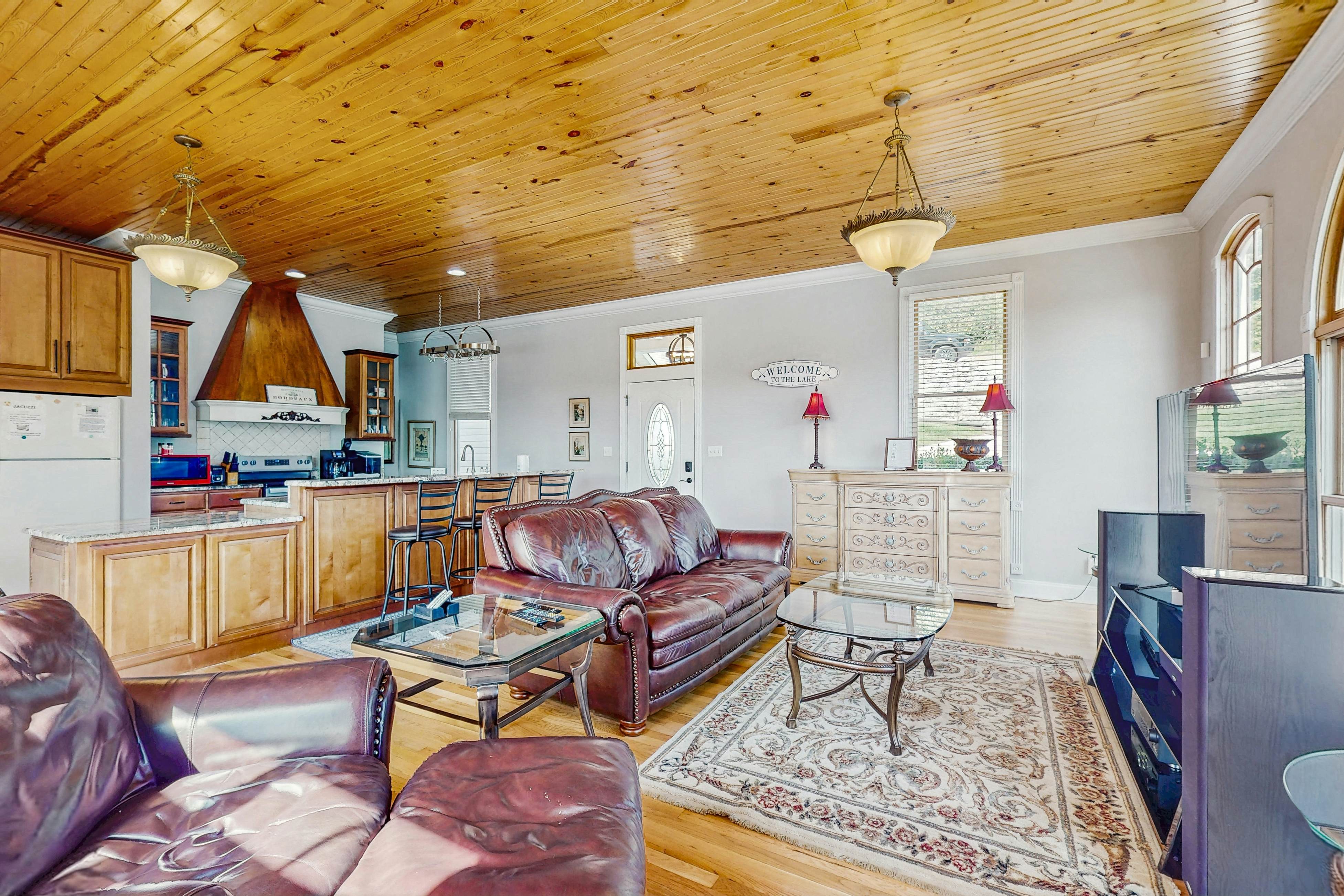 Stunning lake front home w/dock, card tables, wet bar, fire pit & amazing views!