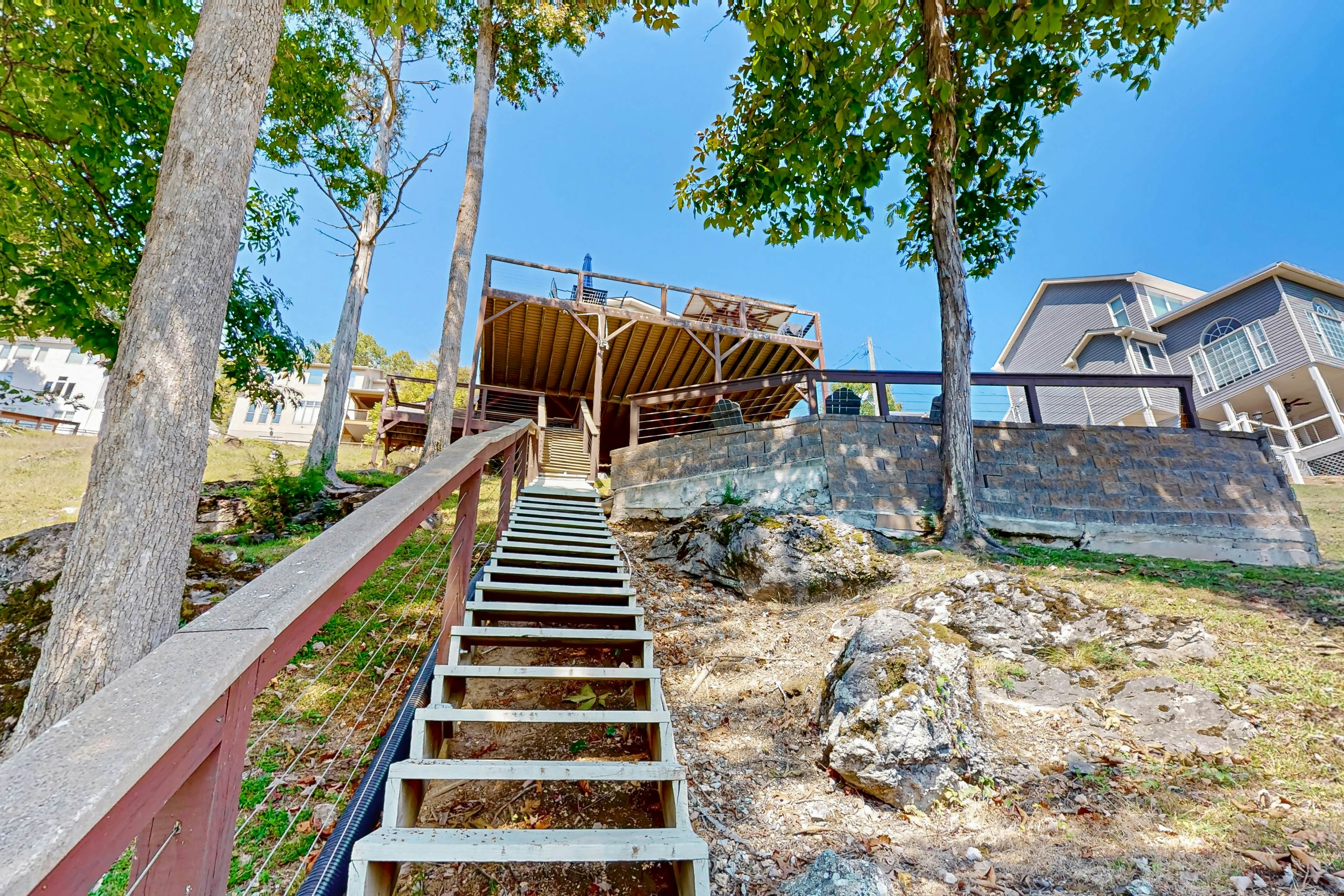 Stunning lake front home w/dock, card tables, wet bar, fire pit & amazing views!