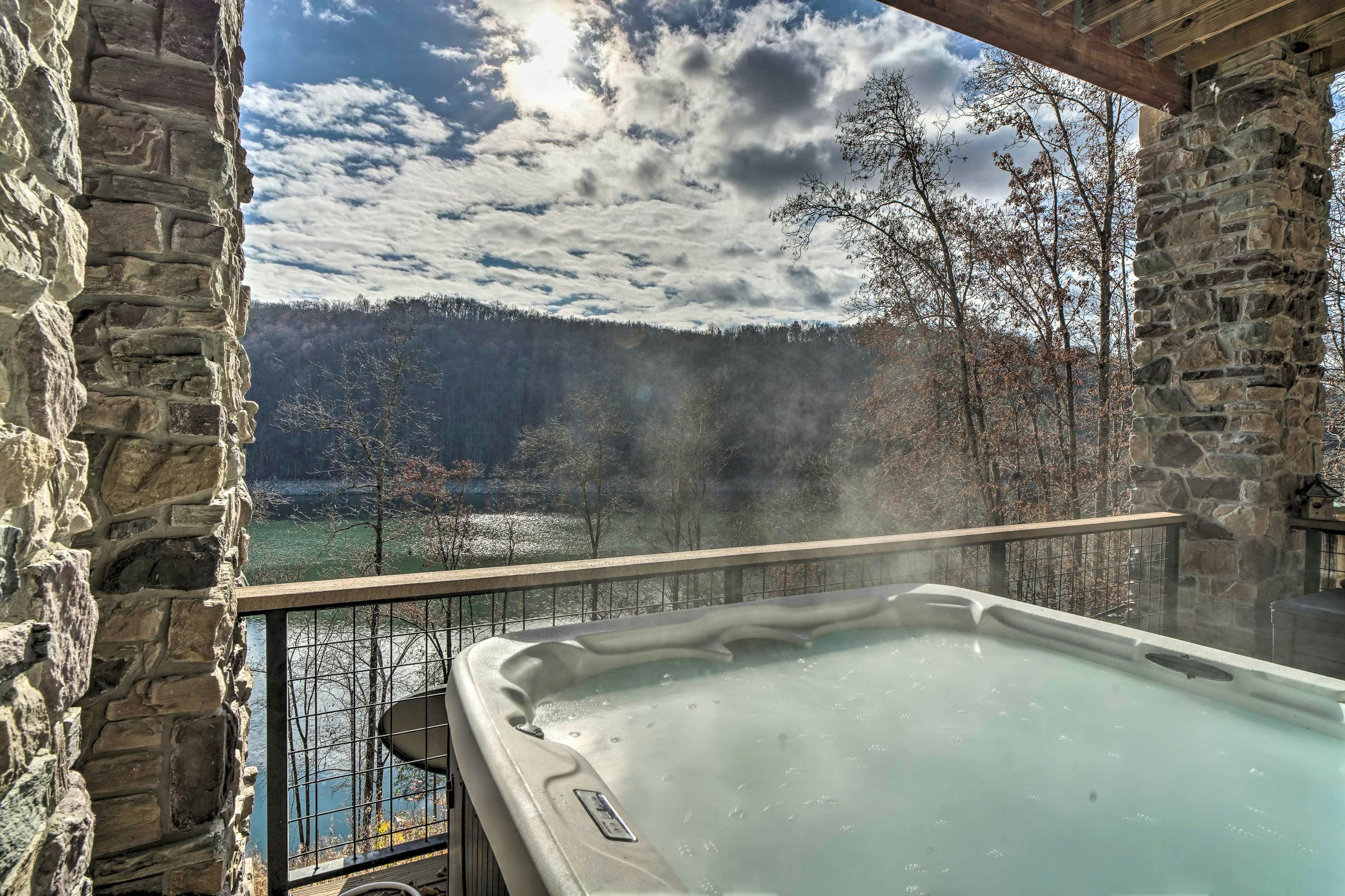 Lakefront cabin with fire pit, lift down to the dock, hot tub, bean bag toss