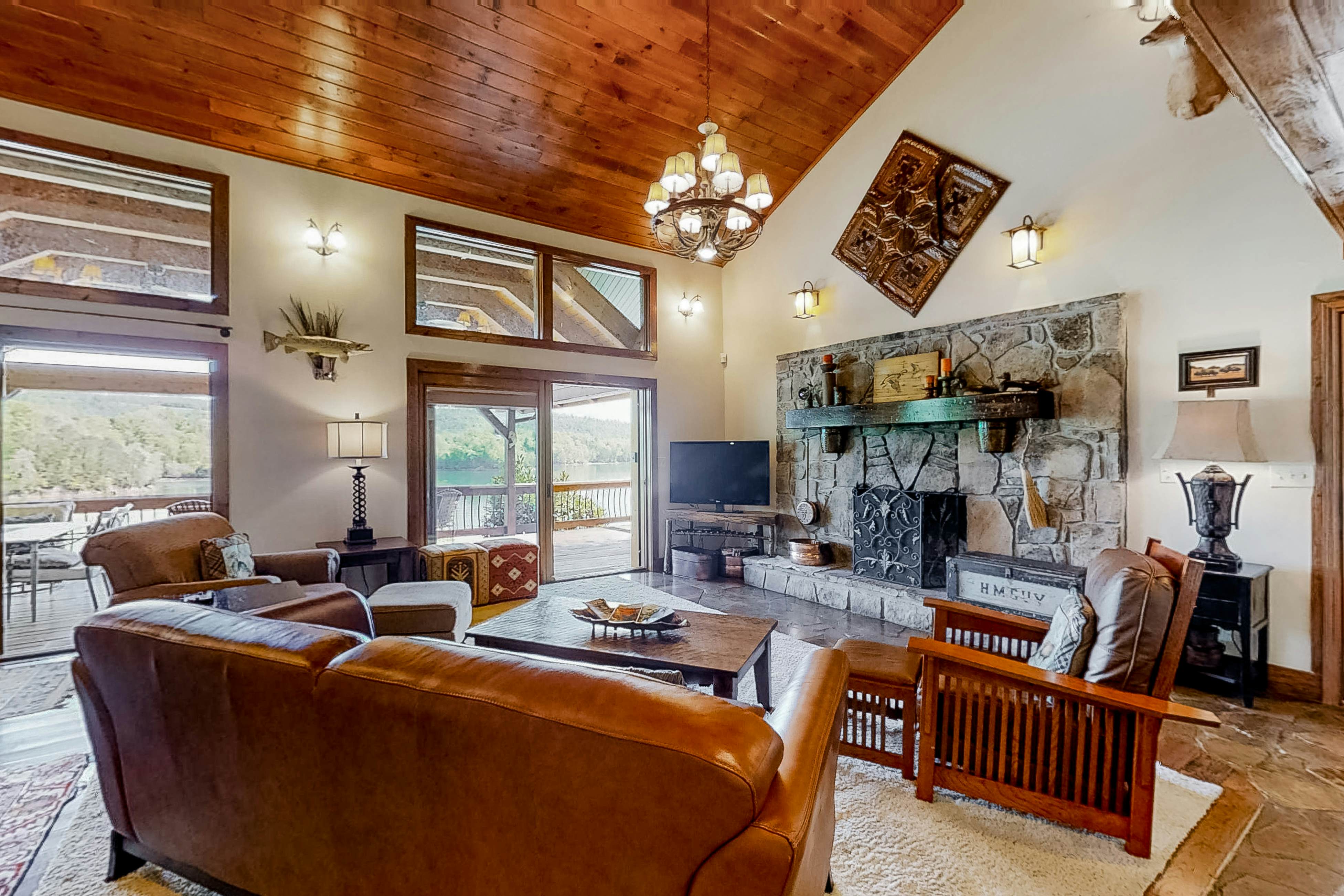 Lakefront home with amazing views, grill, fire pit, private dock, & AC