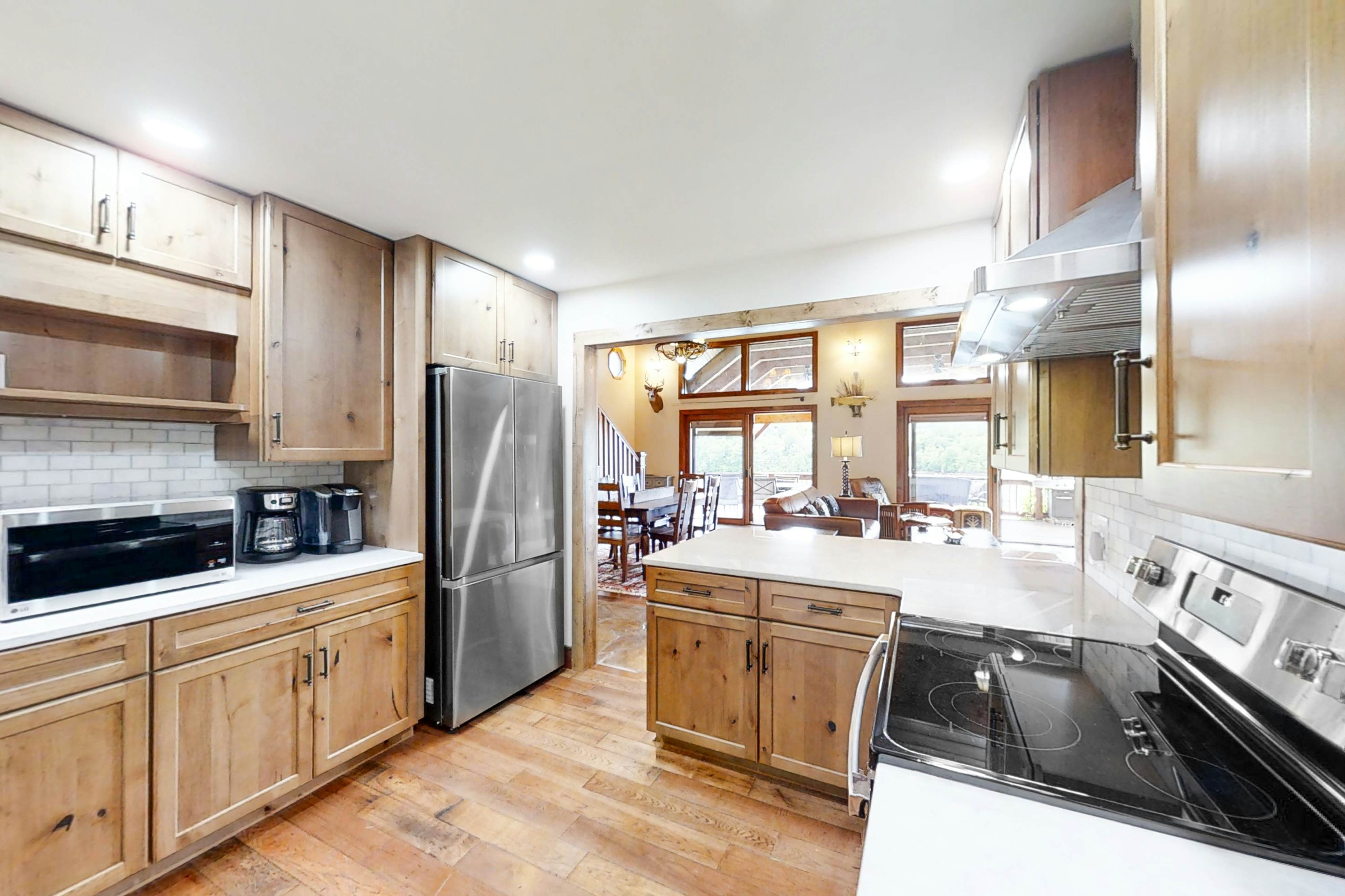 Lakefront home with amazing views, grill, fire pit, private dock, & AC