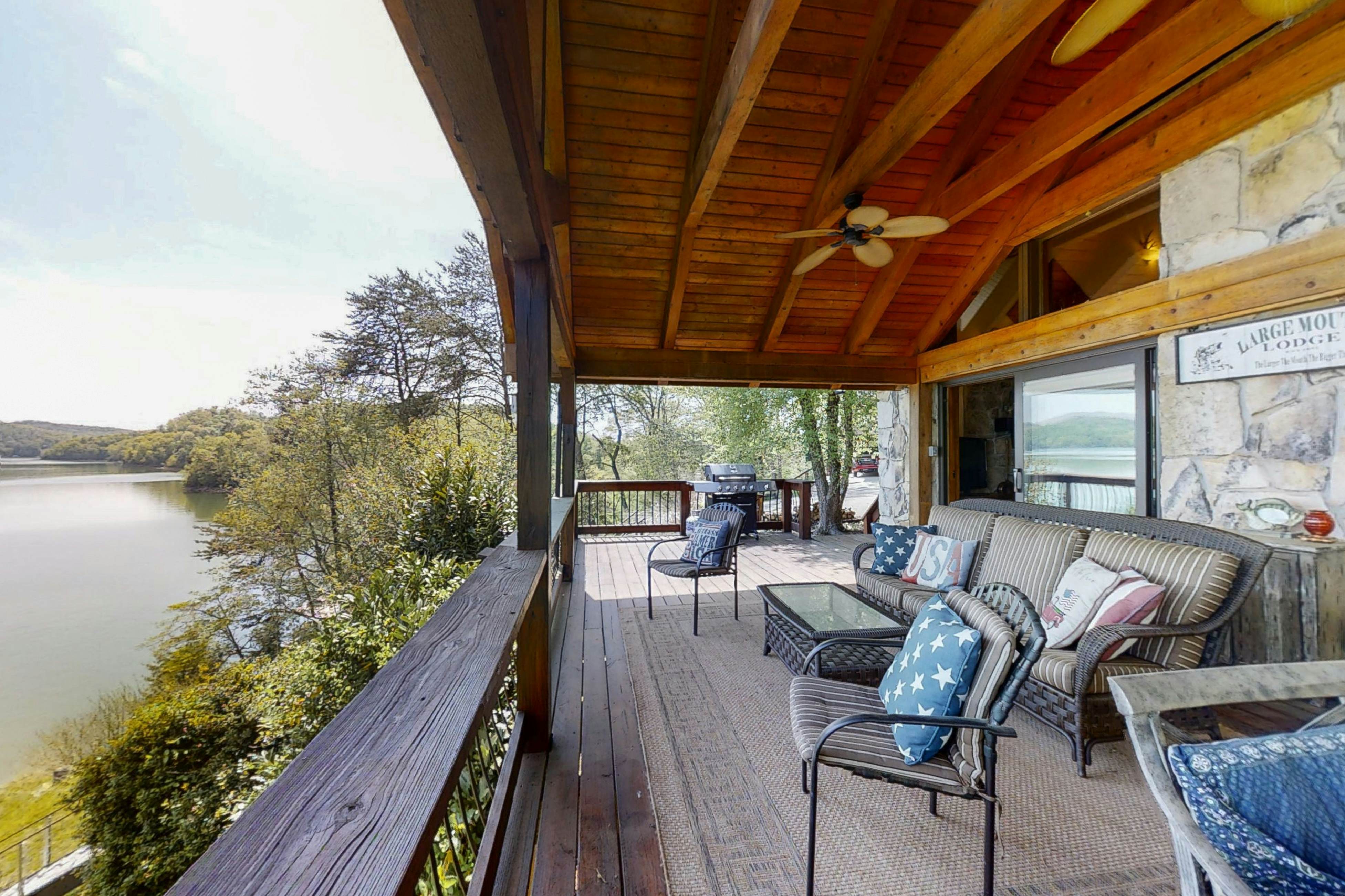 Lakefront home with amazing views, grill, fire pit, private dock, & AC