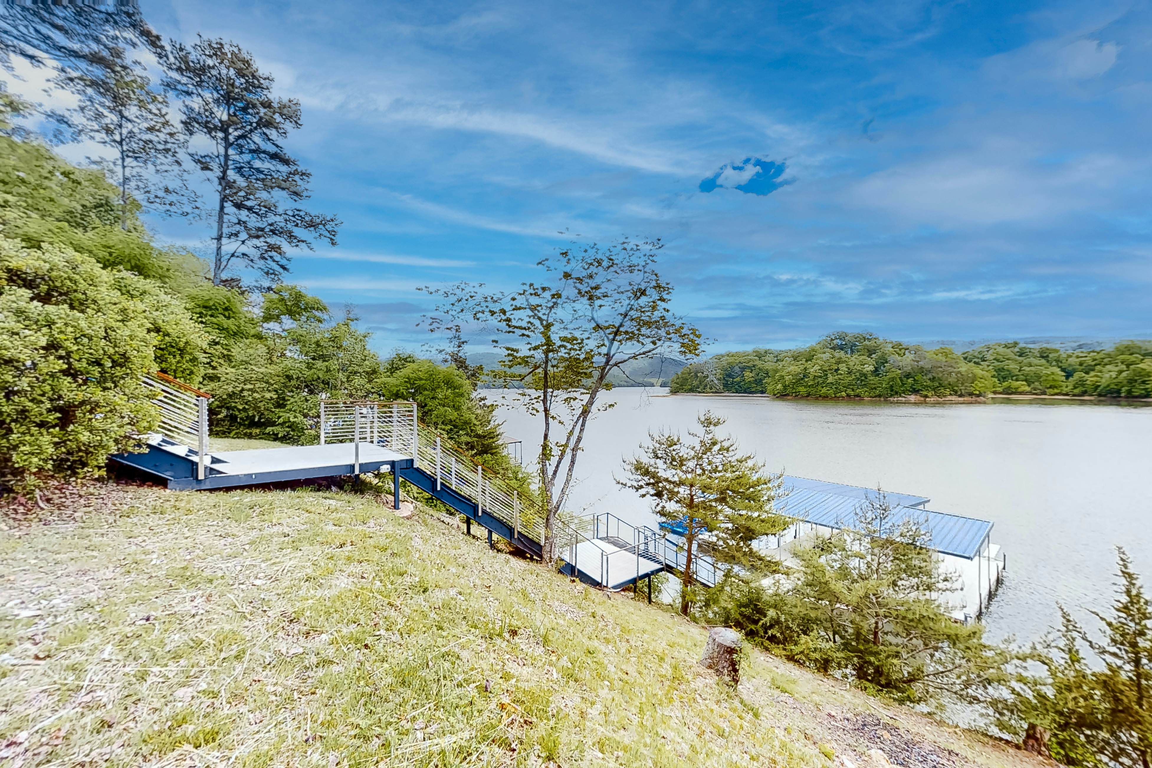 Lakefront home with amazing views, grill, fire pit, private dock, & AC