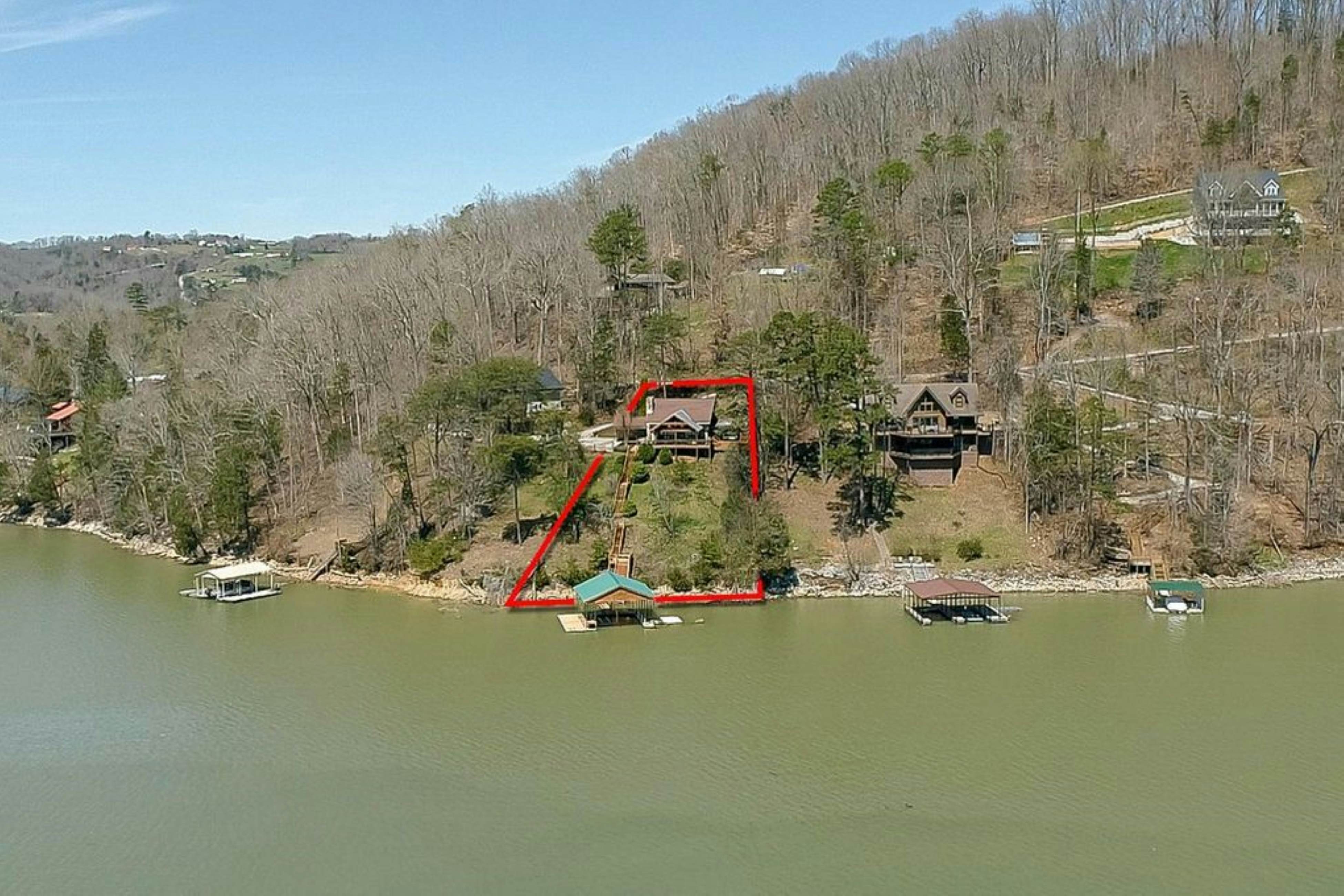 Lakefront home with amazing views, grill, fire pit, private dock, & AC