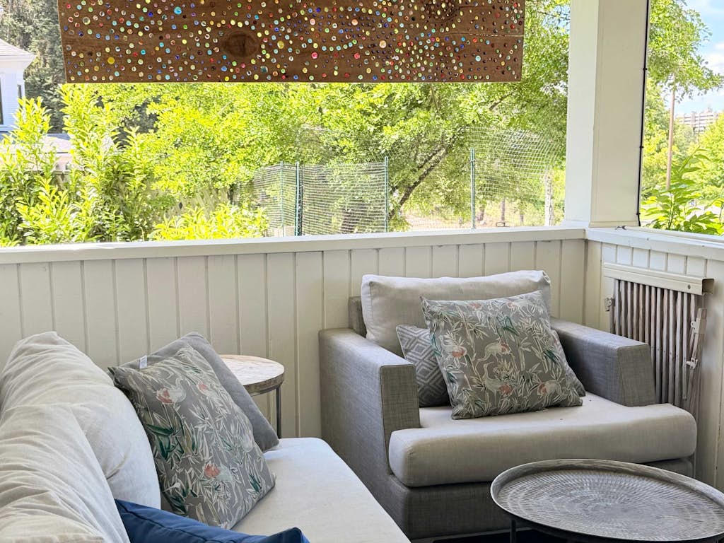 Wake up in the heart of Coeur d'Alene's most walkable neighborhood—a thoughtfully restored 1920s home where 5 bedrooms, 3 bathrooms, and genuine gathering spaces make it the perfect retreat for families and friend groups. Walk to restaurants, downtown shops, McEuen Park's splash pad and playgrounds, and the City Beach boardwalk. With a real kitchen designed for cooking, free parking, and outdoor spaces perfect for evening gatherings, everything your group needs is here or steps away.
