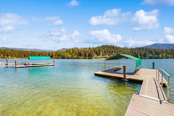 Secluded akefront home with private dock, two-level deck, & BBQ area