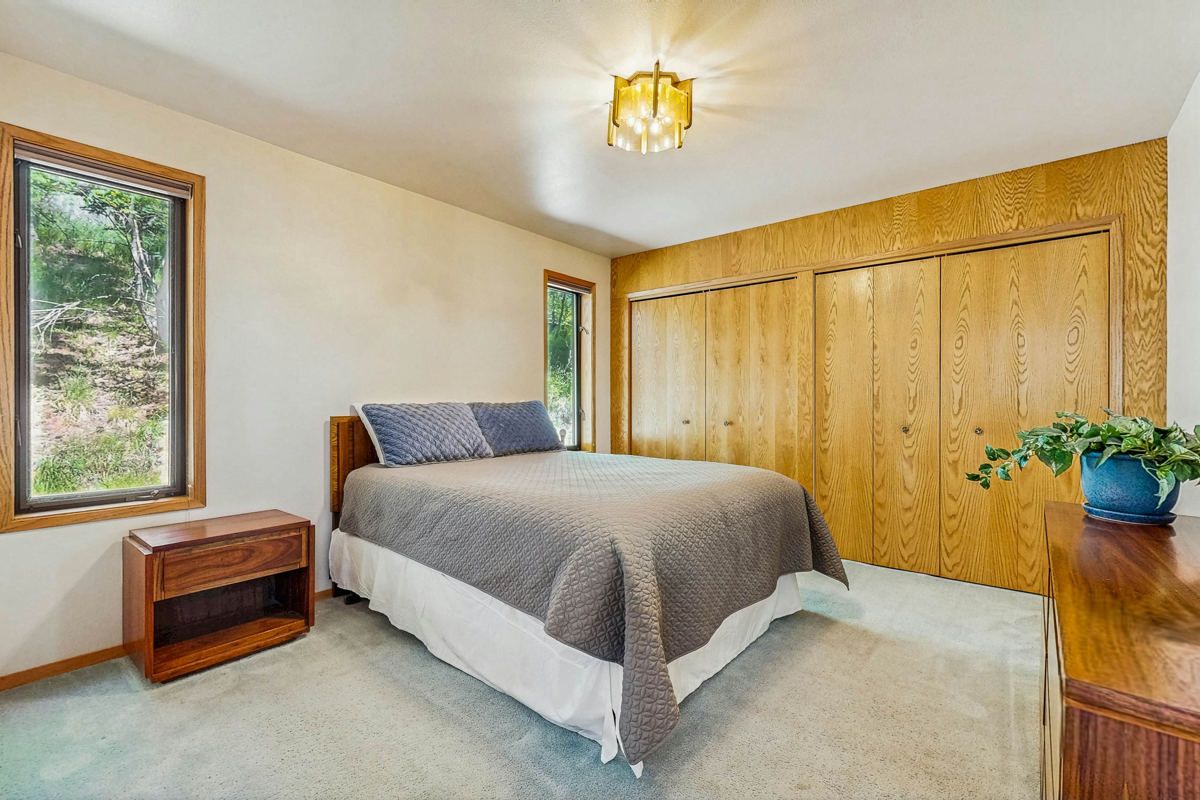 Secluded akefront home with private dock, two-level deck, & BBQ area