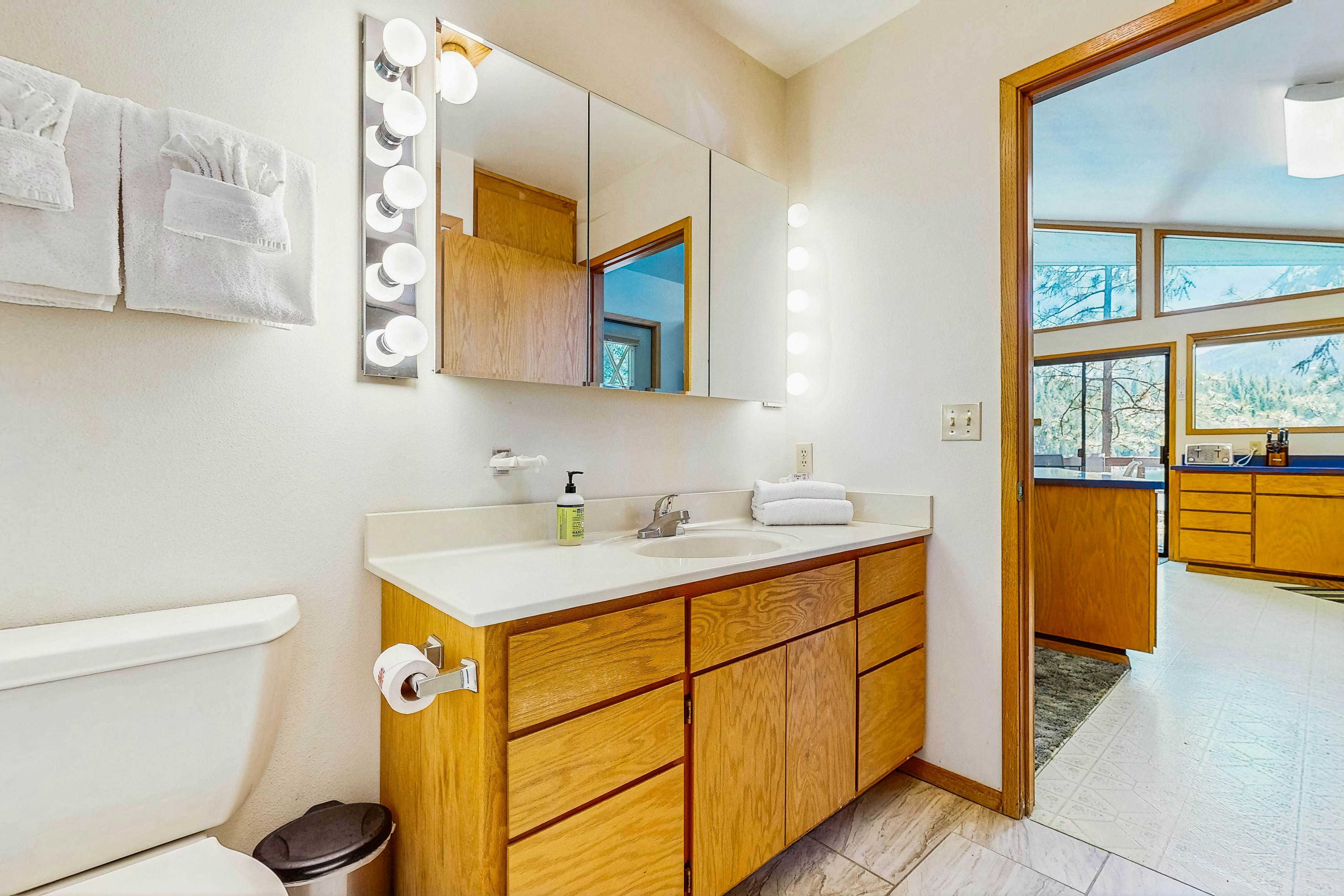 Secluded akefront home with private dock, two-level deck, & BBQ area