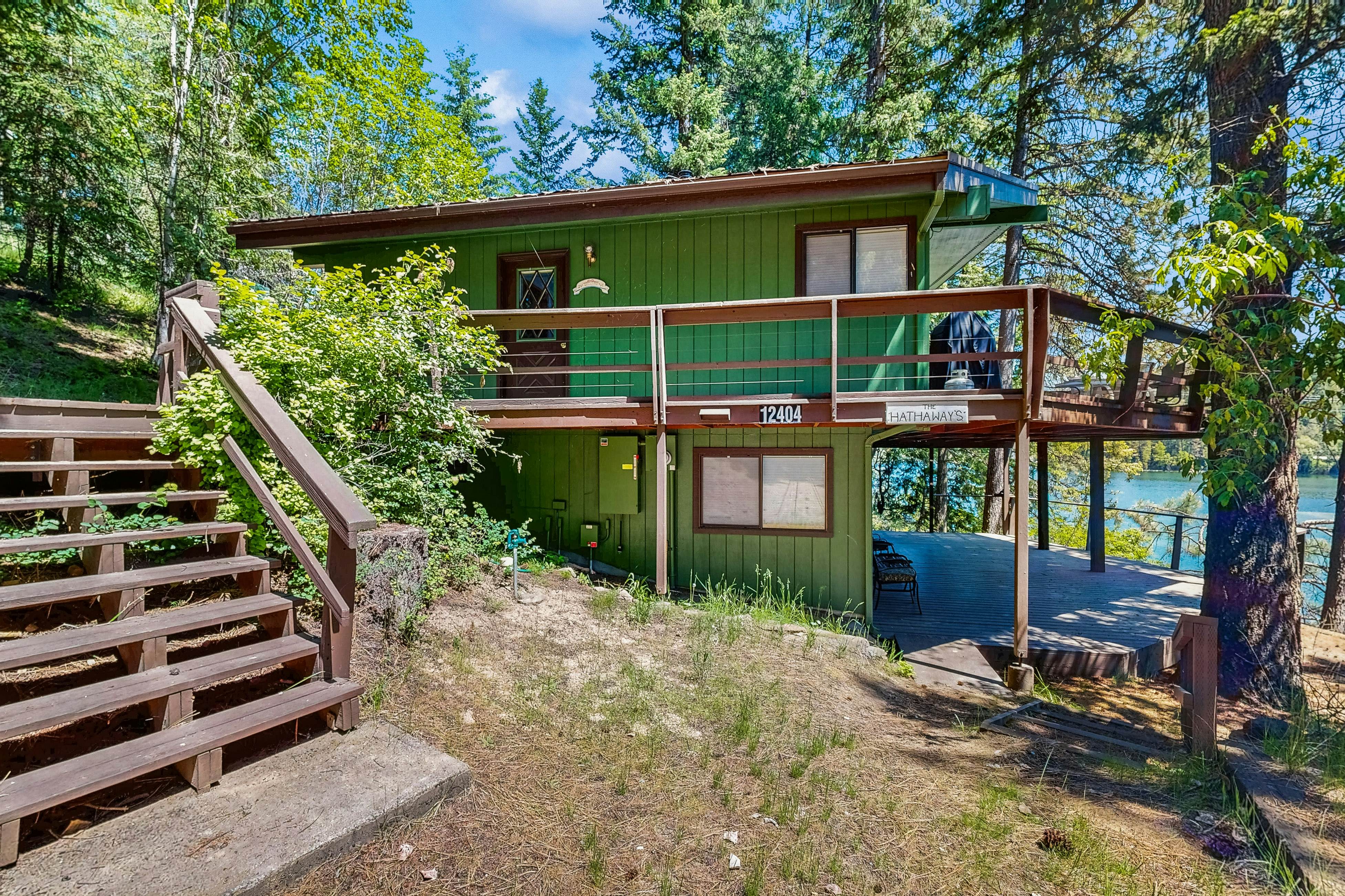 Secluded akefront home with private dock, two-level deck, & BBQ area