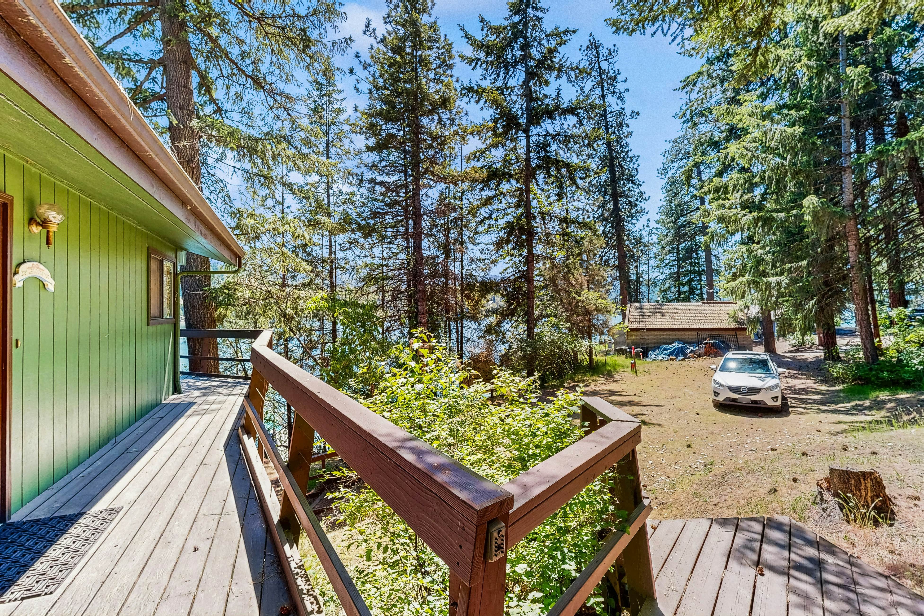 Secluded akefront home with private dock, two-level deck, & BBQ area