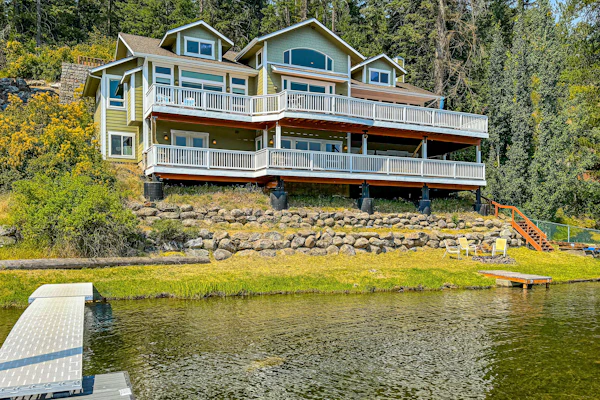 Imagine stepping out of your bedroom directly onto a sun-soaked deck, coffee in hand, watching the water ripple in the morning light. This 4-bedroom lakefront home on Idaho's most iconic lake is built for exactly that kind of moment—the kind where you forget to check your phone and simply exist in the peace and quiet.