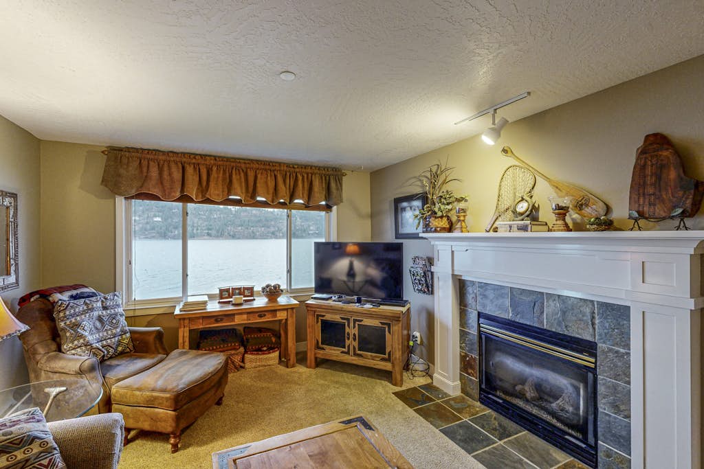 Discover a luxurious waterfront condo with unparalleled lake and mountain views, featuring a private balcony for serene sunset moments. Enjoy direct lake access, perfect for water sports, and a family-friendly environment. This condo promises an unforgettable getaway.