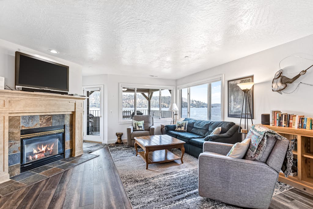 Lakefront Condo with Balcony & Mountain Views
