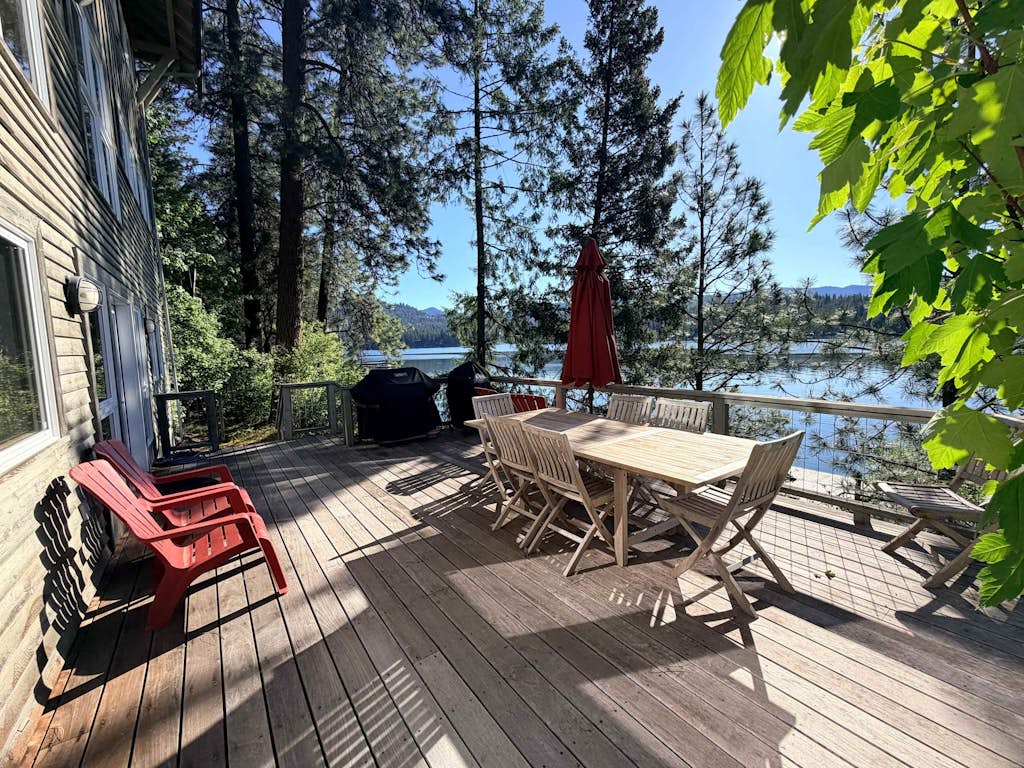Escape to a stunning lakefront house offering breathtaking mountain and water views. Enjoy a spacious home with a private dock, perfect for swimming, fishing, or simply soaking up the sun. Relax by the indoor wood fireplace or on the outdoor patio, and explore nearby attractions like the lake, trails, and surrounding nature.