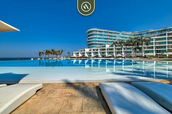 Modern 2BR Beachfront Retreat in Flamingos: 1.5BA, BBQ & Private Balcony