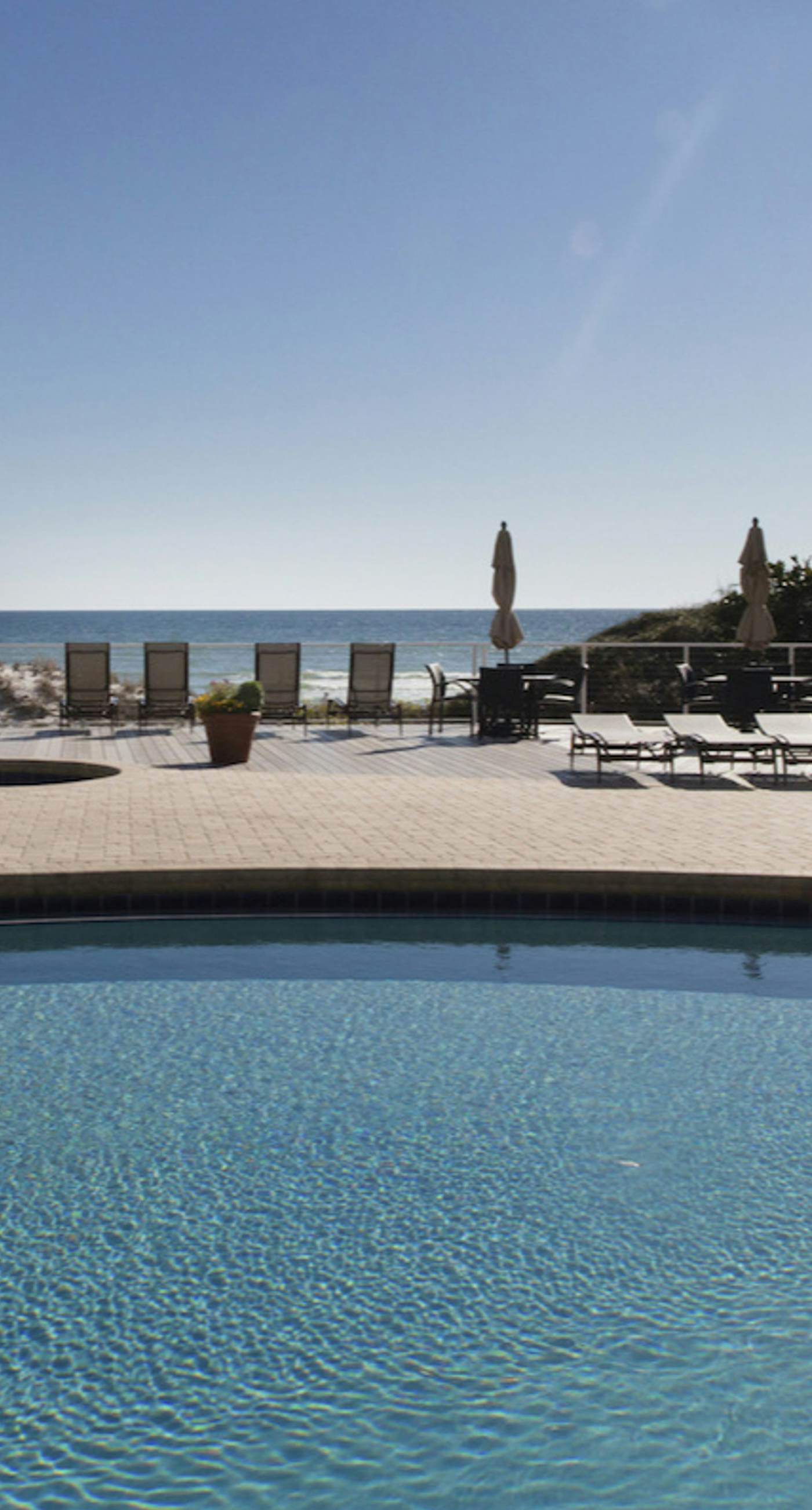 Bright Beachfront Condo with Pool and Balcony